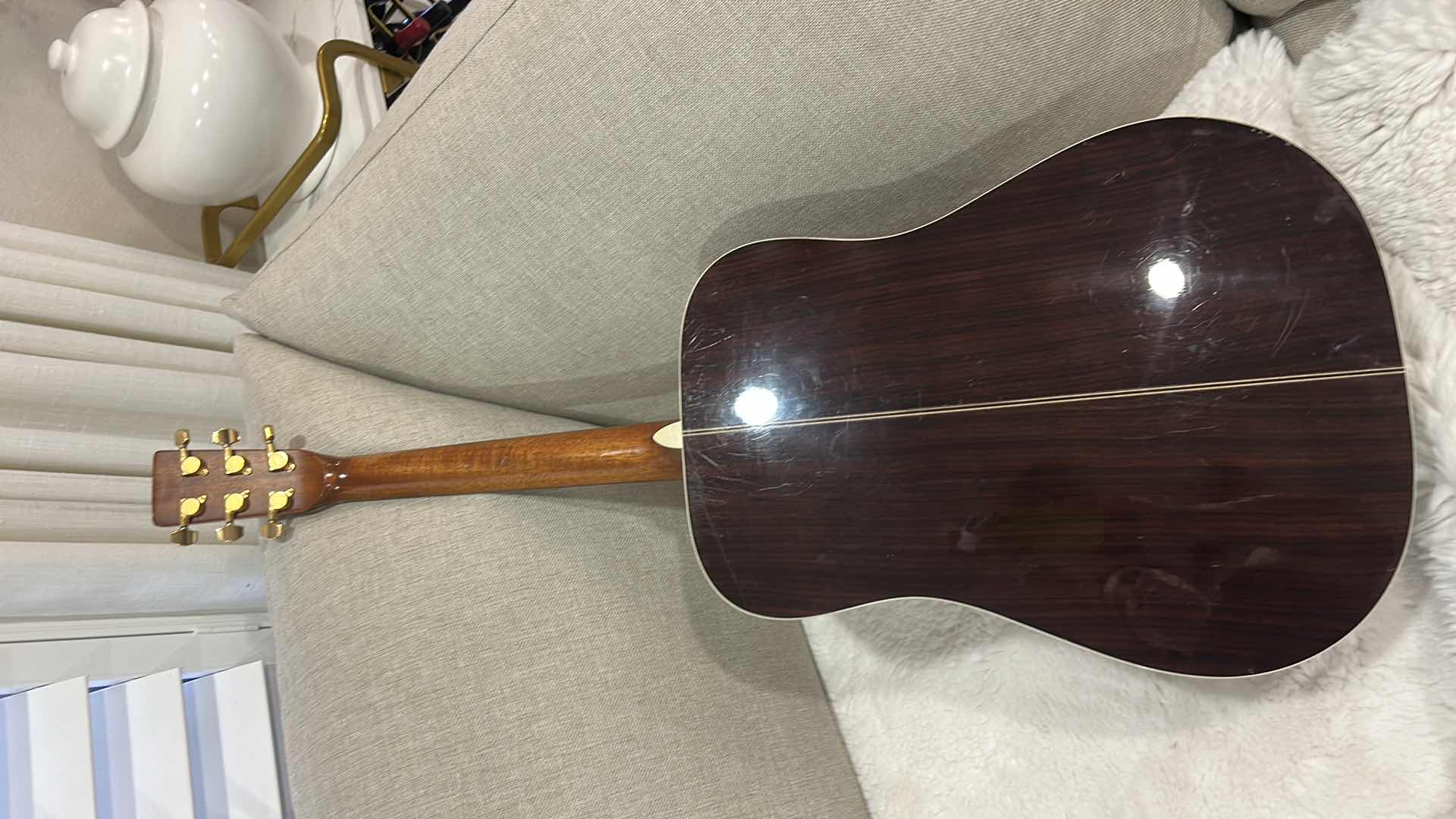 Photo 1 of JB PLAYER DREADNAUGHT GUITAR
ABOUT 34 YEARS OLD WELL WORN AND PLAYEDMOST PROBABLY A VENEER ROSEWOOD BACK AND SIDE WITH A SPRUCE TOPWOOD IS SEPARATING IN THE UPPER AND LOWER BOUTS GOTOH LOCKING GOLD TUNERS