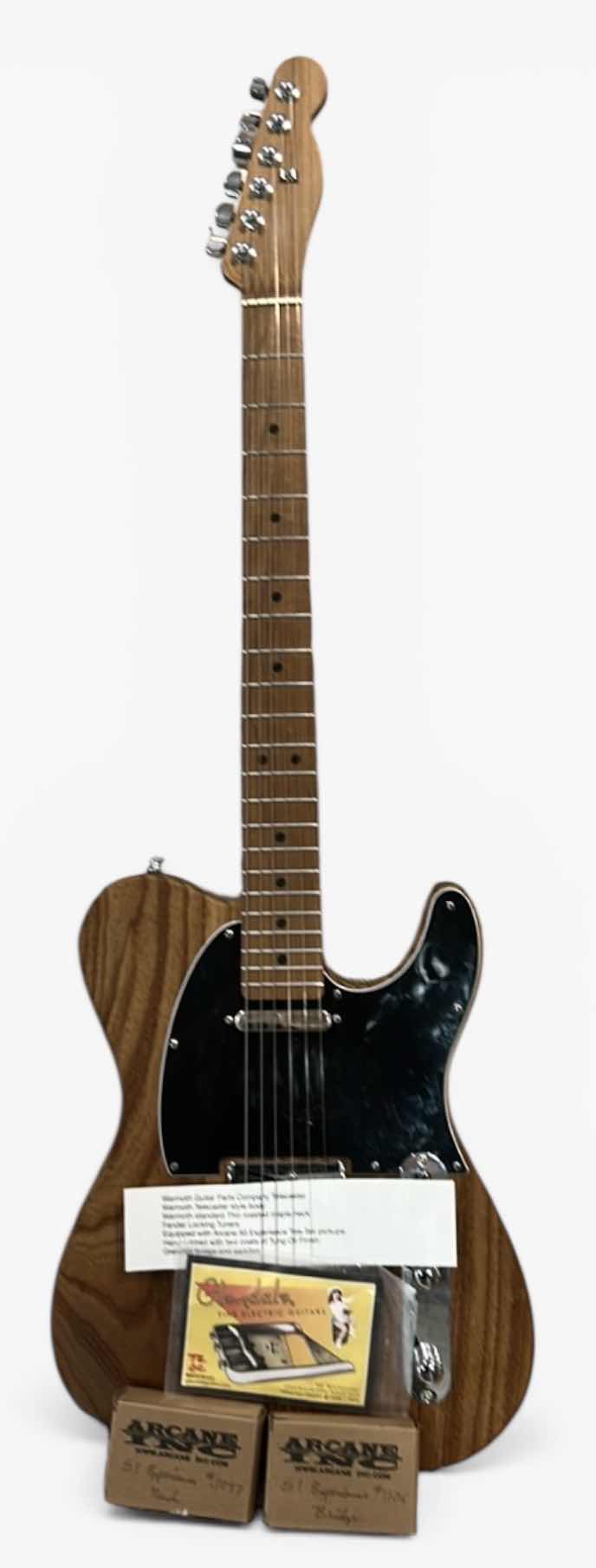 Photo 1 of WARMOTH GUITAR PARTS COMPANY TELECASTER
WARMOTH TELECASTER STYLE BODY
WARMOTH STANDARD THIN ROASTED MAPLE NECK
FENDER LOCKING TUNERS
EQUIPPED WITH ARCANE 50 EXPERIENCE TELE SET PICKUPS
HAND RUBBED WITH TWO COATS OF TUNG OIL FINISH 
GLENDALE BRIDGE AND SAD