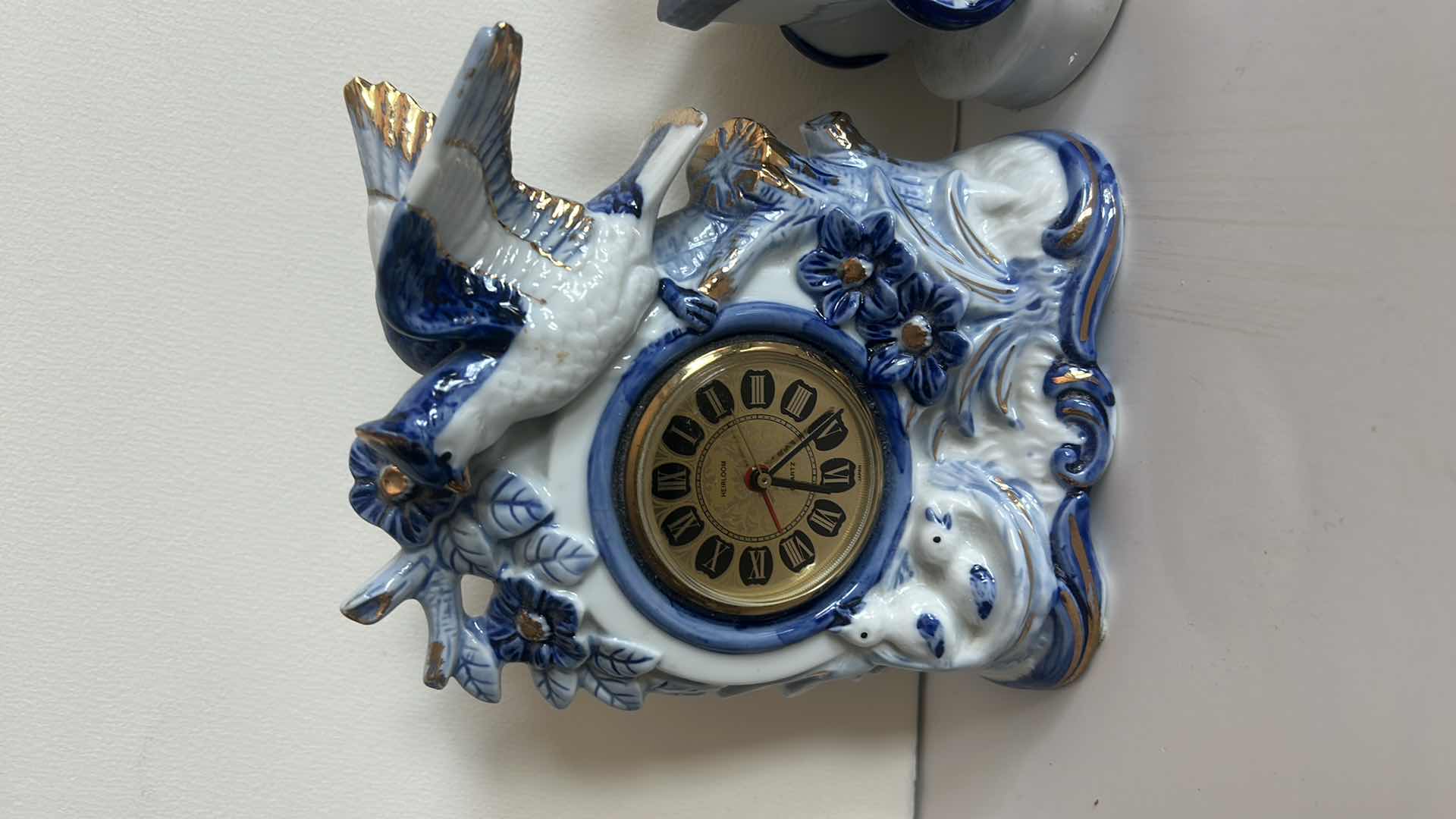 Photo 1 of 2- BLUE AND WHITE PORCELAIN PIECES, MANTLE CLOCK H6.5” AND CARRIAGE