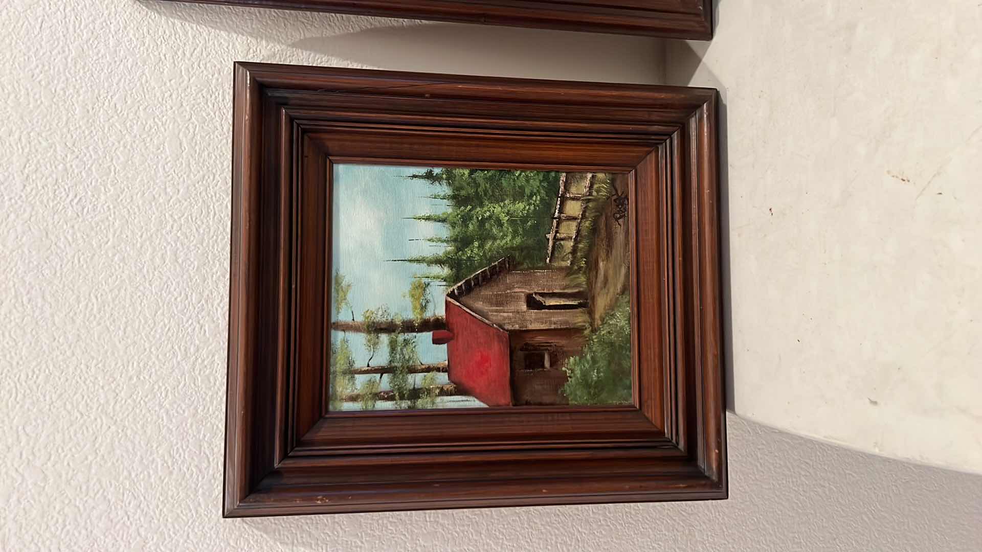 Photo 1 of 2-WOOD FRAMED CANVAS “CABIN & WOODED TREES” OIL PAINTINGS-ARTIST SIGNED (16” x 19” & 14” x 16”)