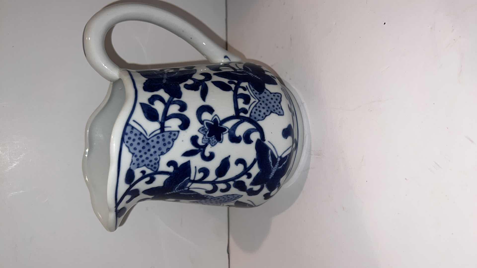 Photo 1 of 4-BLUE & WHITE CERAMIC PITCHERS (TALLEST HEIGHT 8”)