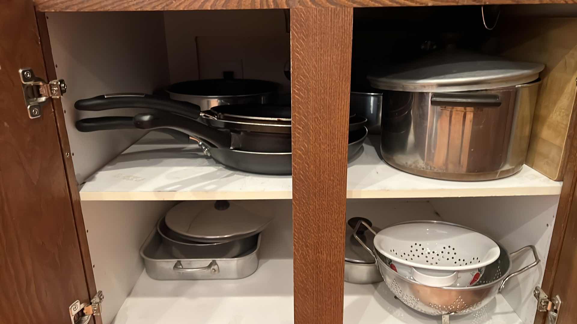 Photo 1 of CONTENTS OF 3-BOTTOM KITCHEN CABINETS-POTS & PANS