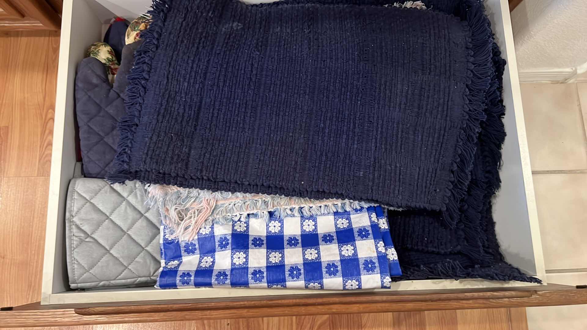 Photo 1 of CONTENTS OF 3-KITCHEN DRAWERS-PLACEMATS, KITCHEN TOWELS