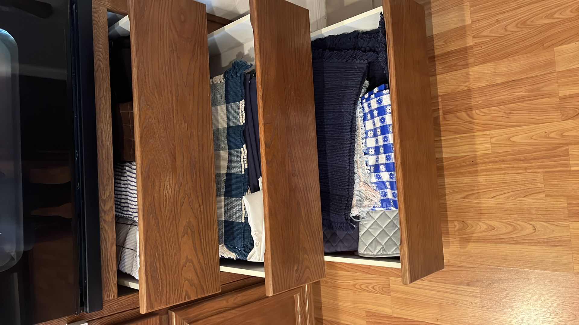 Photo 1 of CONTENTS OF 3-KITCHEN DRAWERS-PLACEMATS, KITCHEN TOWELS