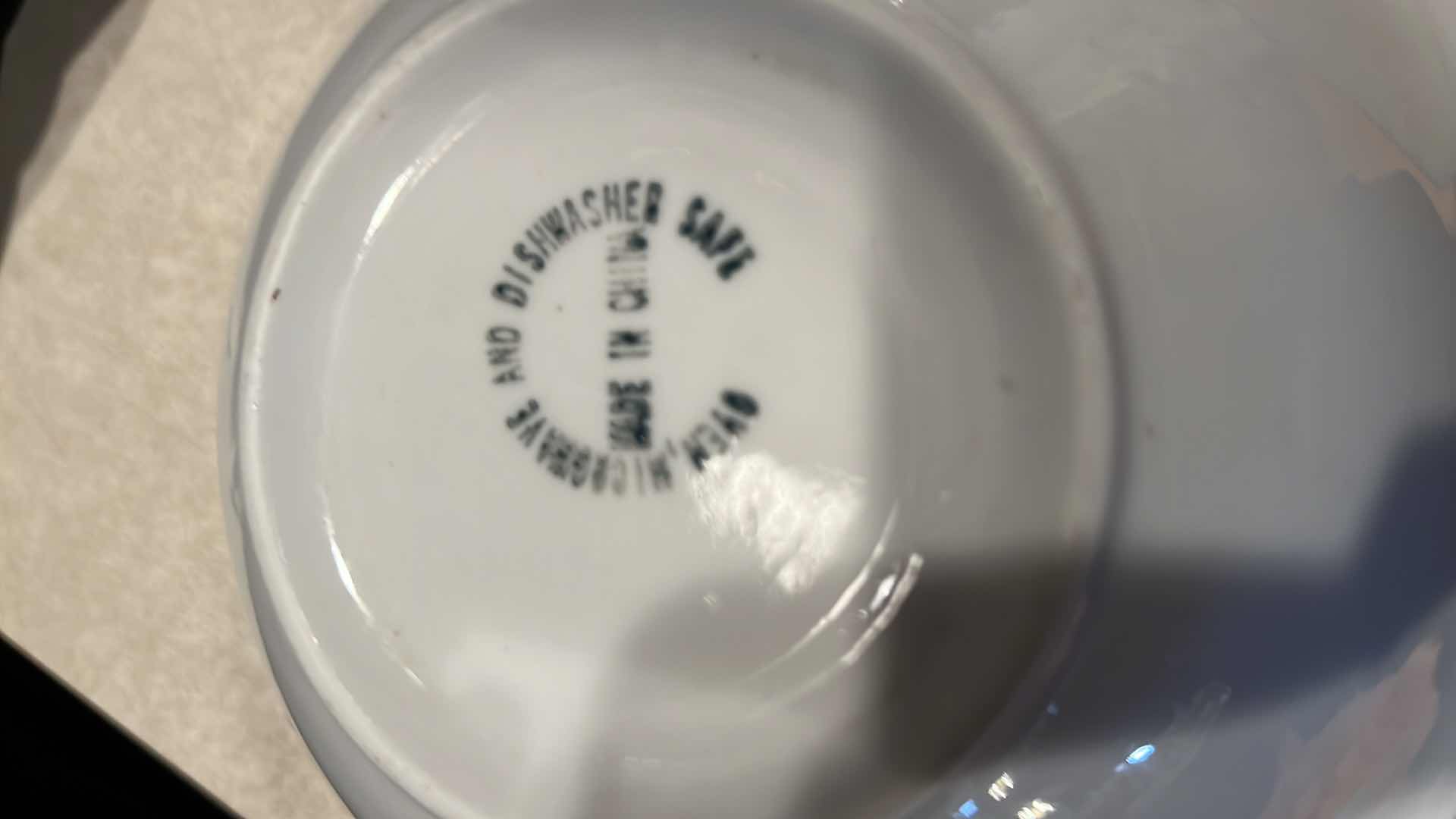 Photo 1 of CONTENTS OF KITCHEN CABINET-BLUE & WHITE CERAMIC DISHES