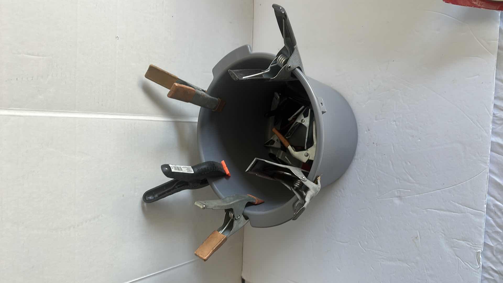 Photo 1 of BOX OF 4”CHIP BRUSHS AND BUCKET OF GRIPS