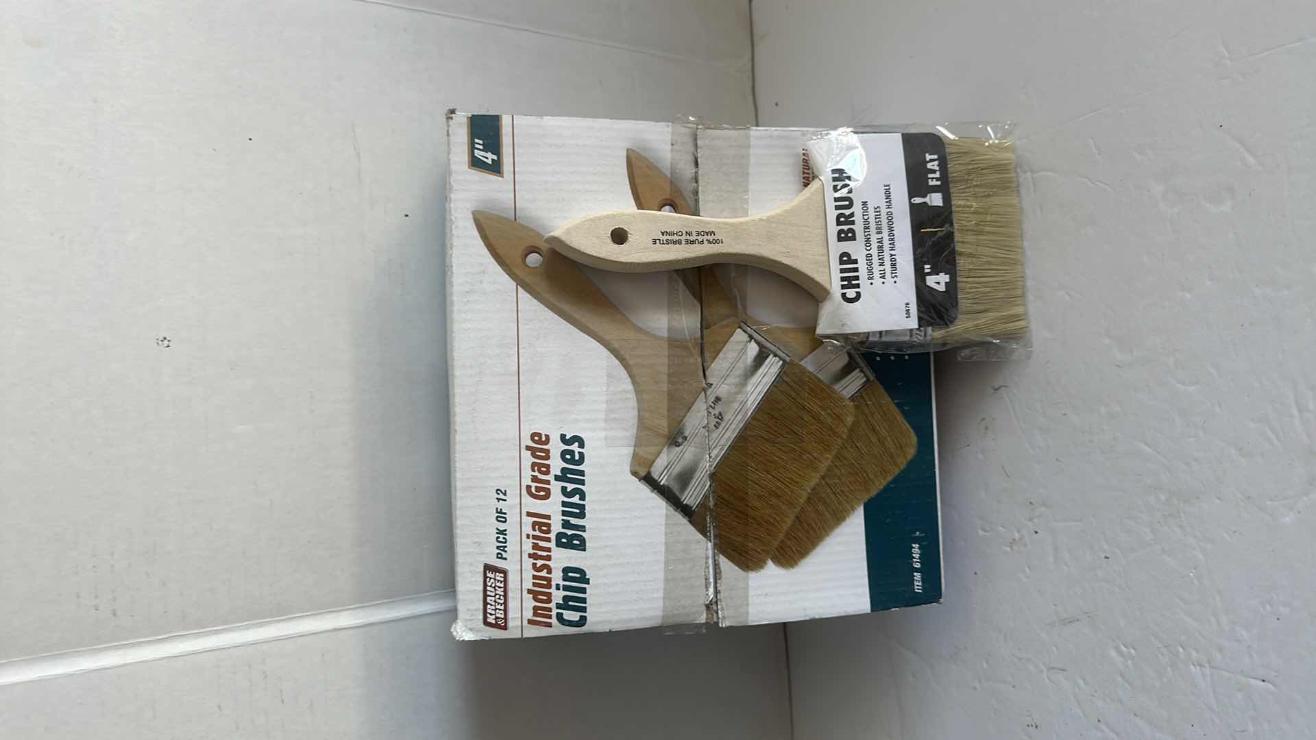 Photo 1 of BOX OF 4”CHIP BRUSHS AND BUCKET OF GRIPS