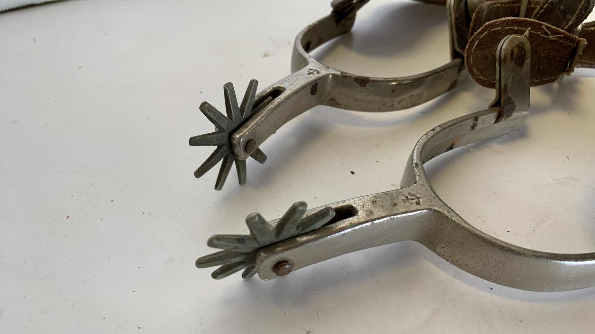 Photo 1 of ANTIQUE NICKEL OVER METAL LEATHER "NORTH AND JUDD" COWBOY SPURS