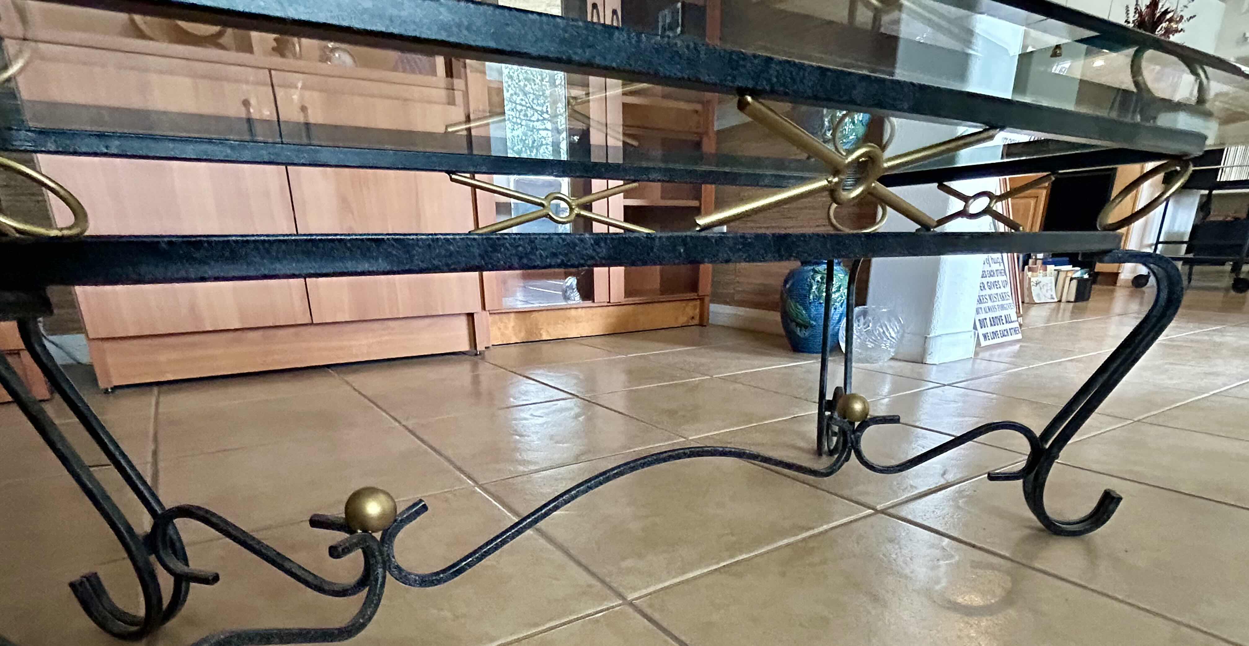 Photo 1 of COFFEE TABLE BLACK IRON W  GLASS TOP & GOLD ACCENTS 36" X 22" H17"