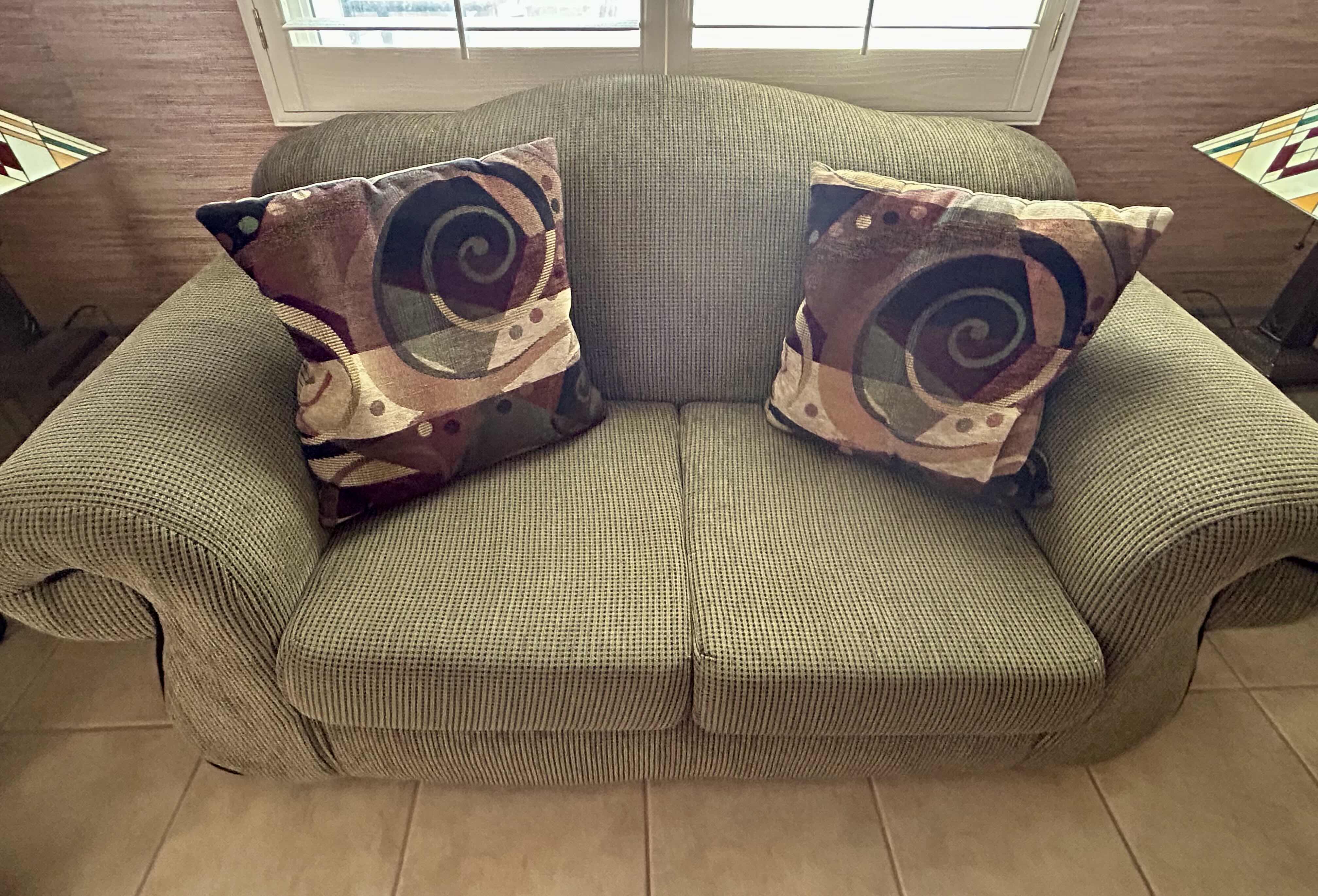 Photo 1 of 5' OLIVE GREEN UPHOLSTERED LOVESEAT W 2 ABSTRACT PILLOWS