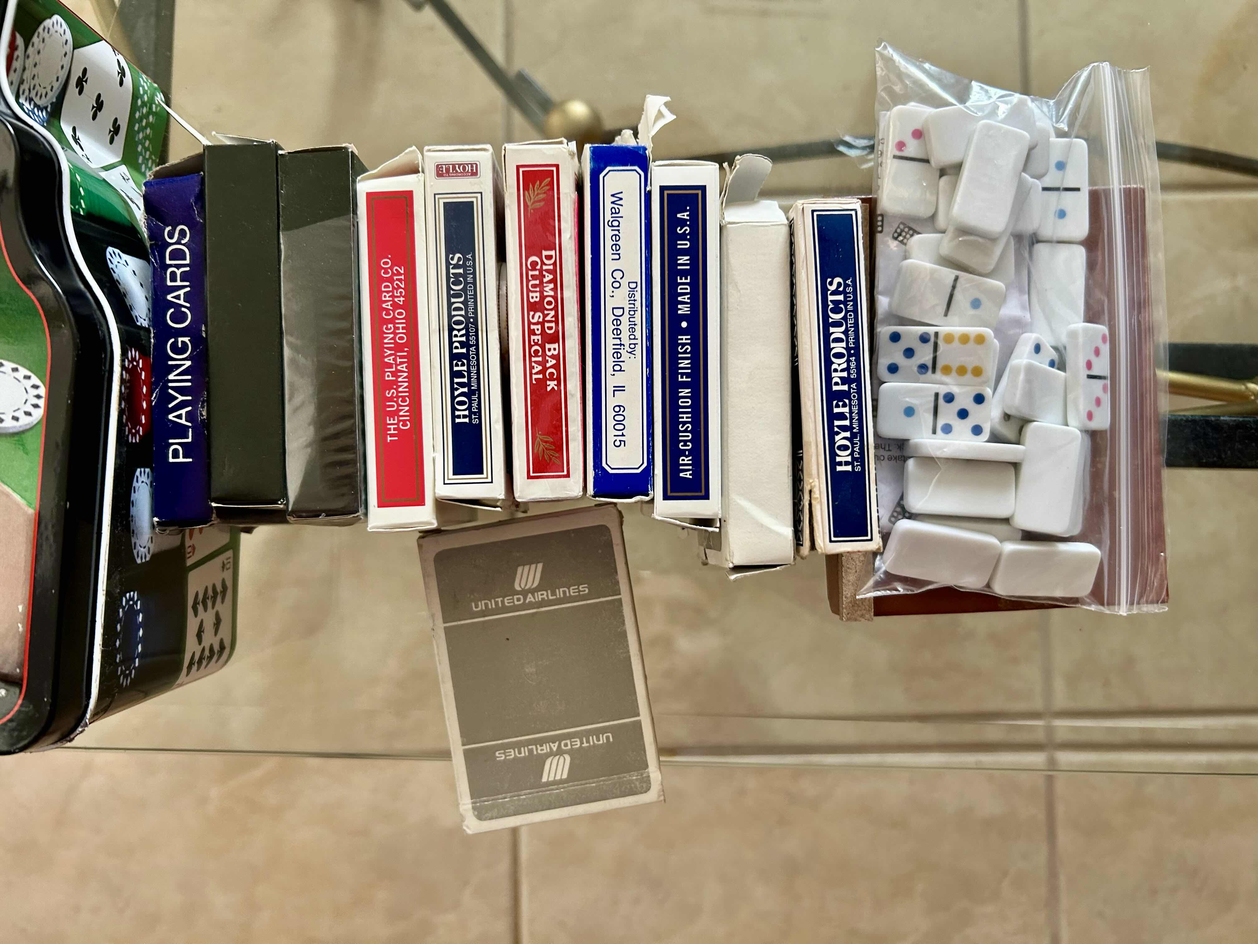 Photo 1 of COLLECTION OF POKER ITEMS: TEXAS HOLD’EM POKER SET WITH ADDITIONAL PLAYING CARDS AND BAG OF DICE