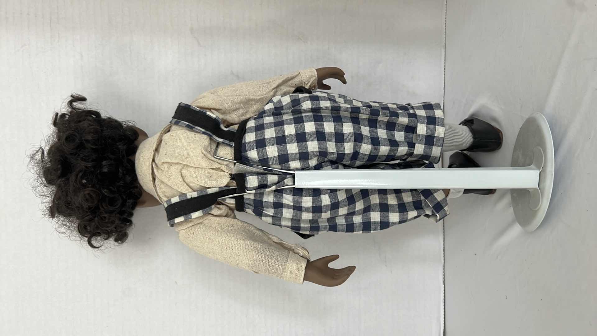 Photo 1 of AFRICAN AMERICAN PORCELAIN DOLL W STAND H20"