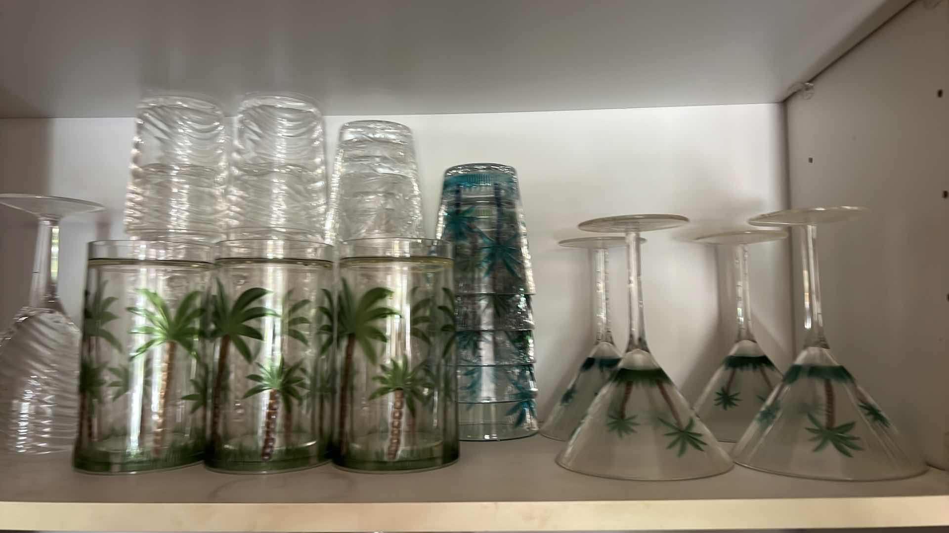 Photo 1 of CONTENTS OF KITCHEN CABINET-PLASTIC DISHES