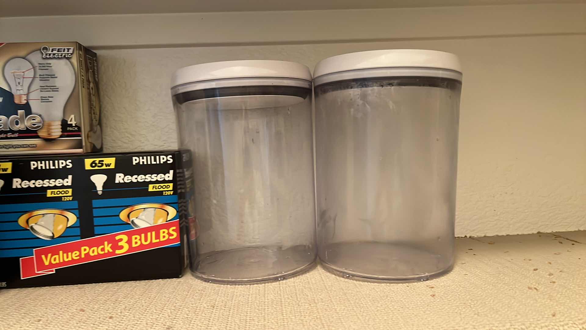 Photo 1 of CONTENTS OF PANTRY SHELF-PLASTC CANISTERS, LIGHT BULBS, MIXER, WRAP