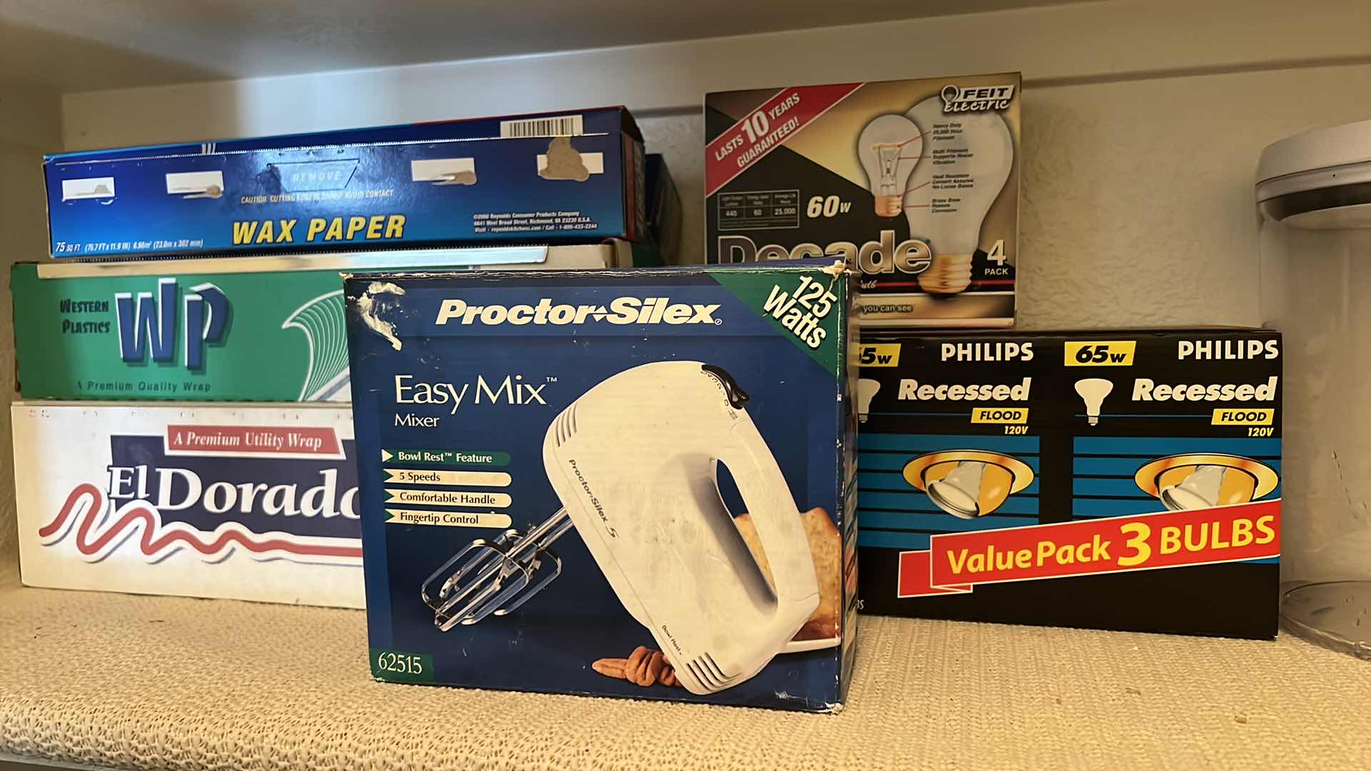 Photo 1 of CONTENTS OF PANTRY SHELF-PLASTC CANISTERS, LIGHT BULBS, MIXER, WRAP