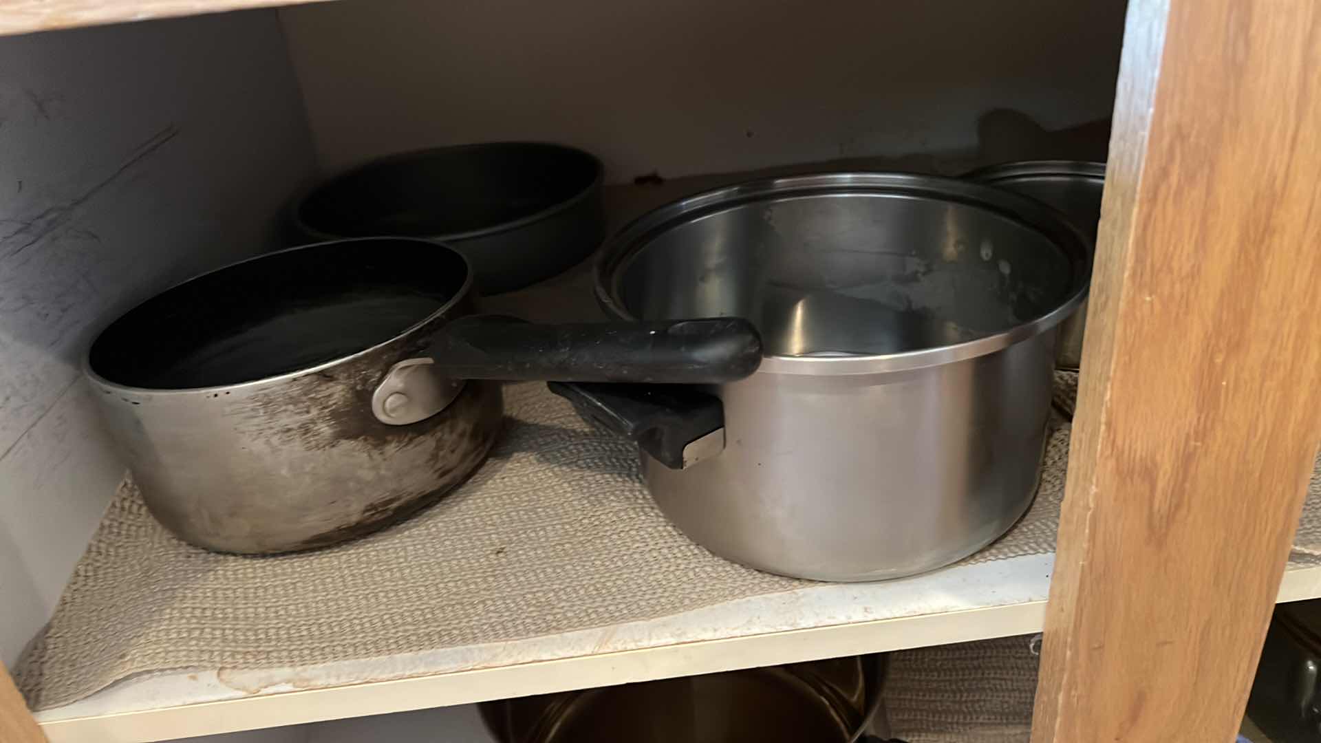 Photo 1 of CONTENTS OF KITCHEN CABINET-POTS & PANS