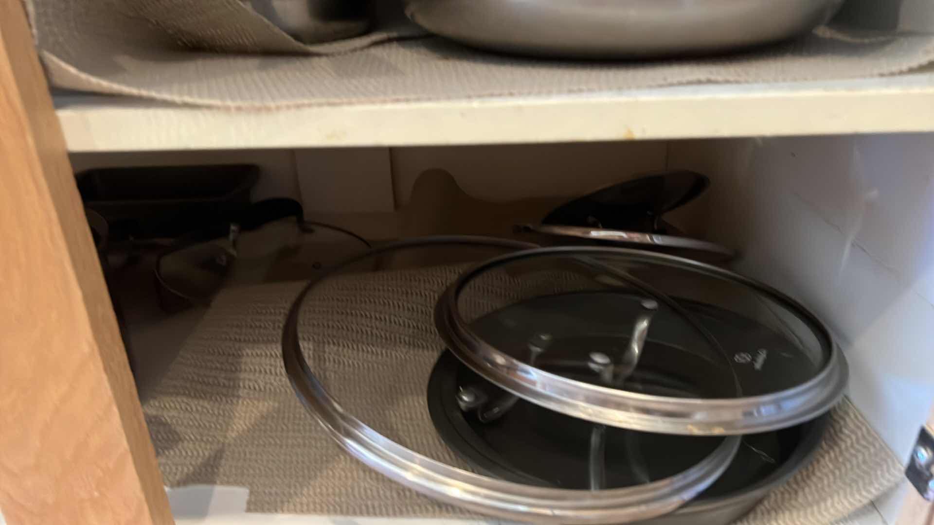 Photo 1 of CONTENTS OF KITCHEN CABINET-POTS & PANS