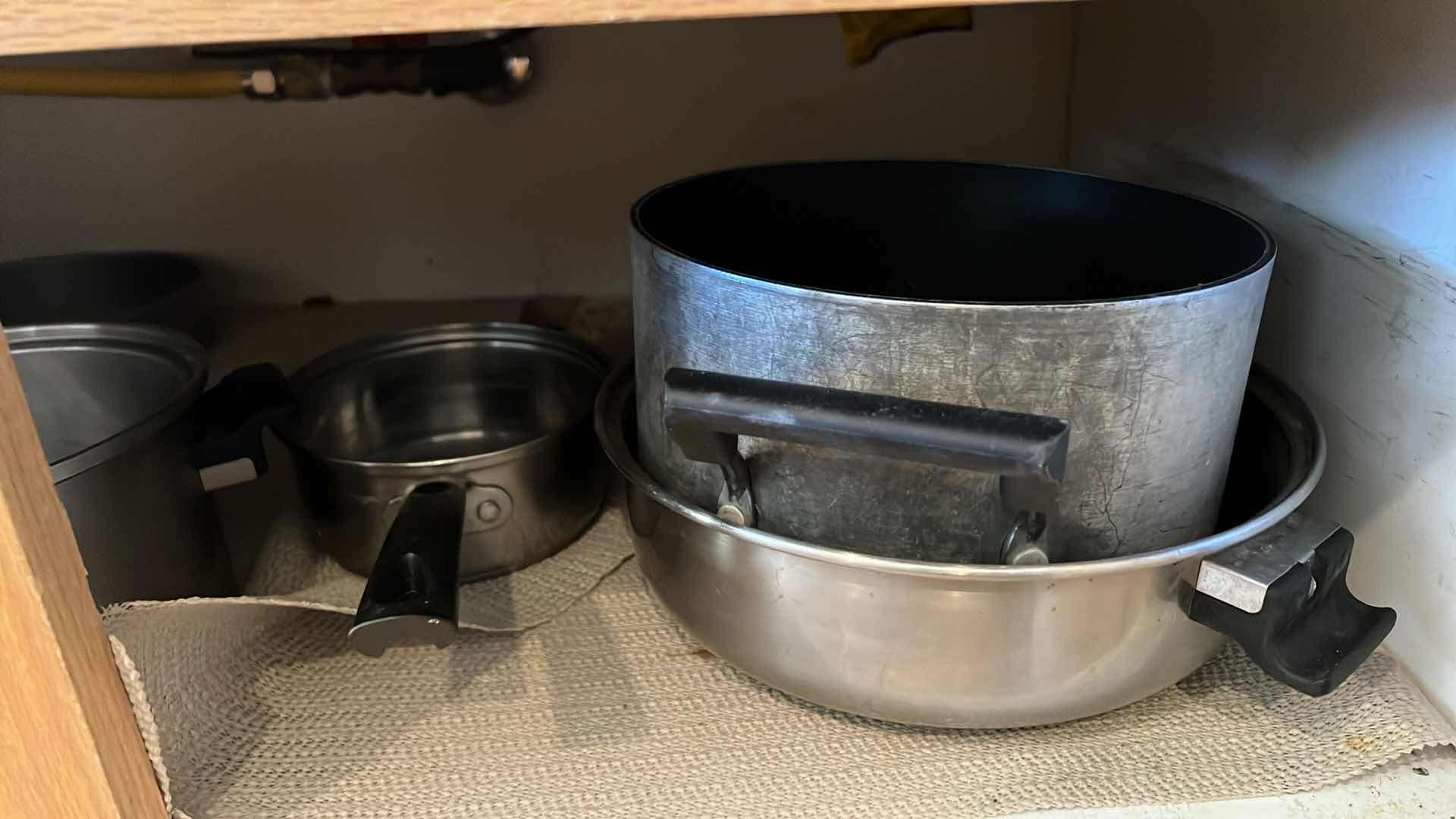 Photo 1 of CONTENTS OF KITCHEN CABINET-POTS & PANS