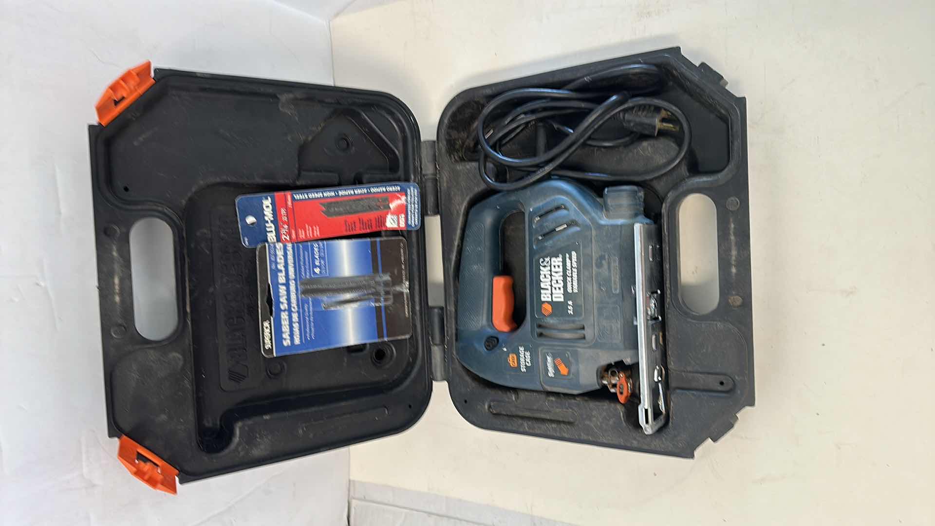 Photo 1 of BLACK AND DECKER SKILL SAW AND BLADES