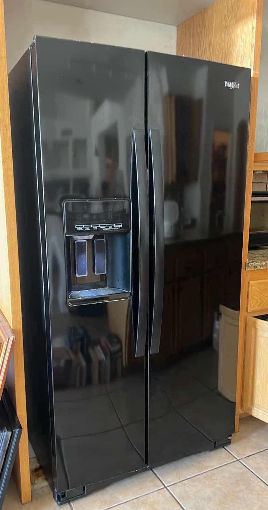 Photo 1 of BLACK WHIRLPOOL SIDE BY SIDE REFRIGERATOR (CONTENTS NOT INCLUDED)