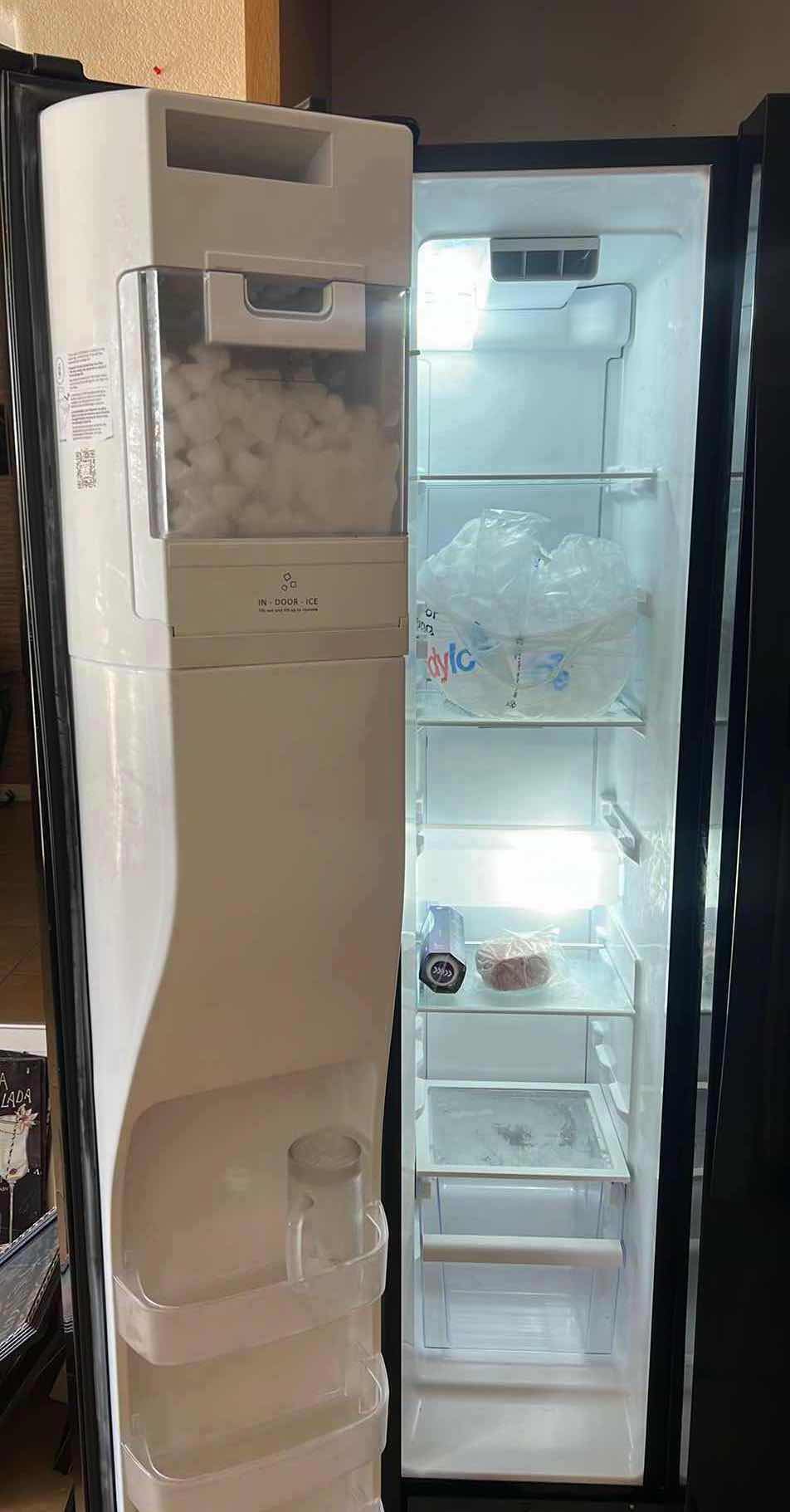 Photo 1 of BLACK WHIRLPOOL SIDE BY SIDE REFRIGERATOR (CONTENTS NOT INCLUDED)