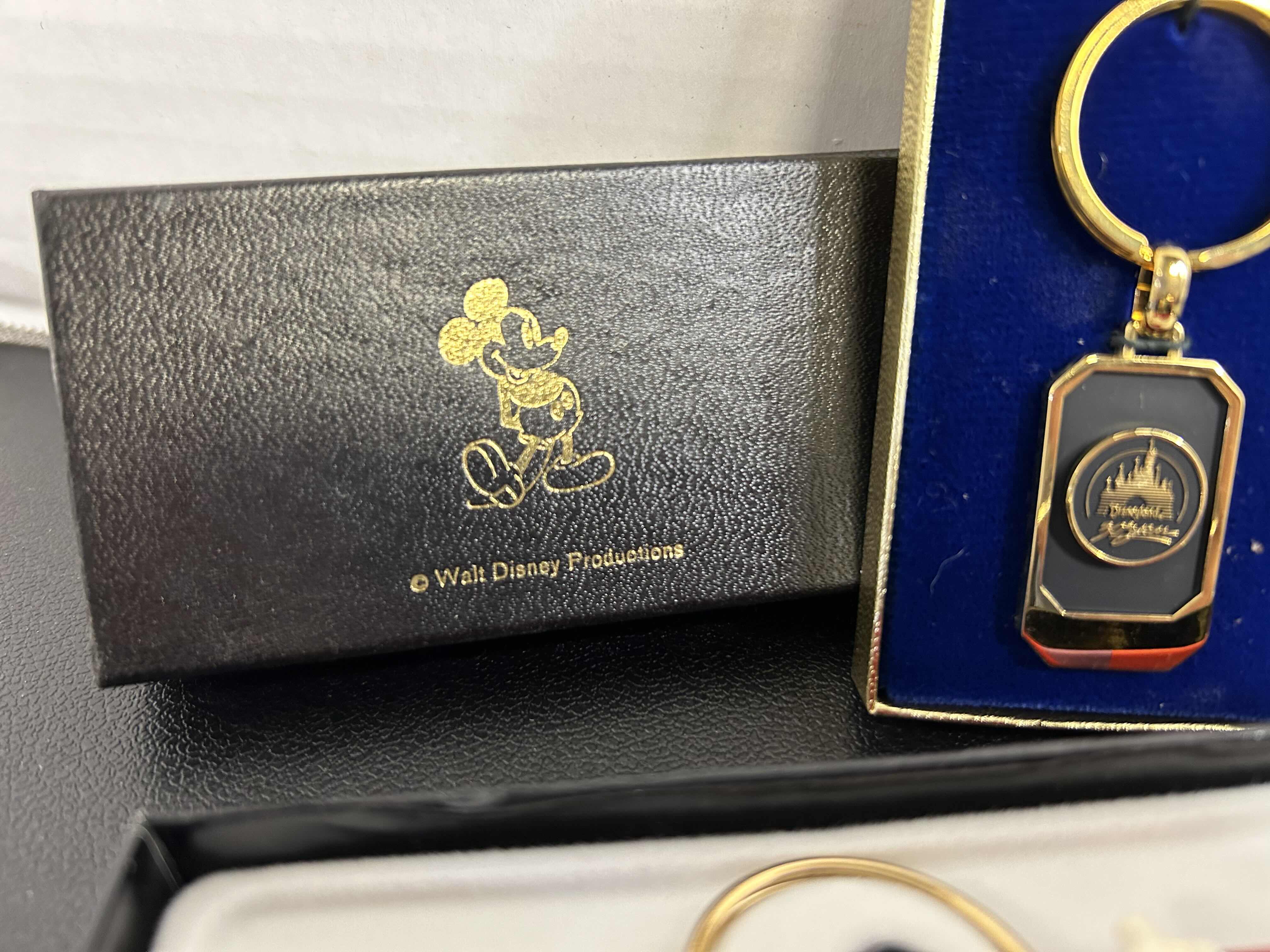 Photo 1 of 3-DISNEY KEYCHAINS AND 1 DISNEY INK PEN