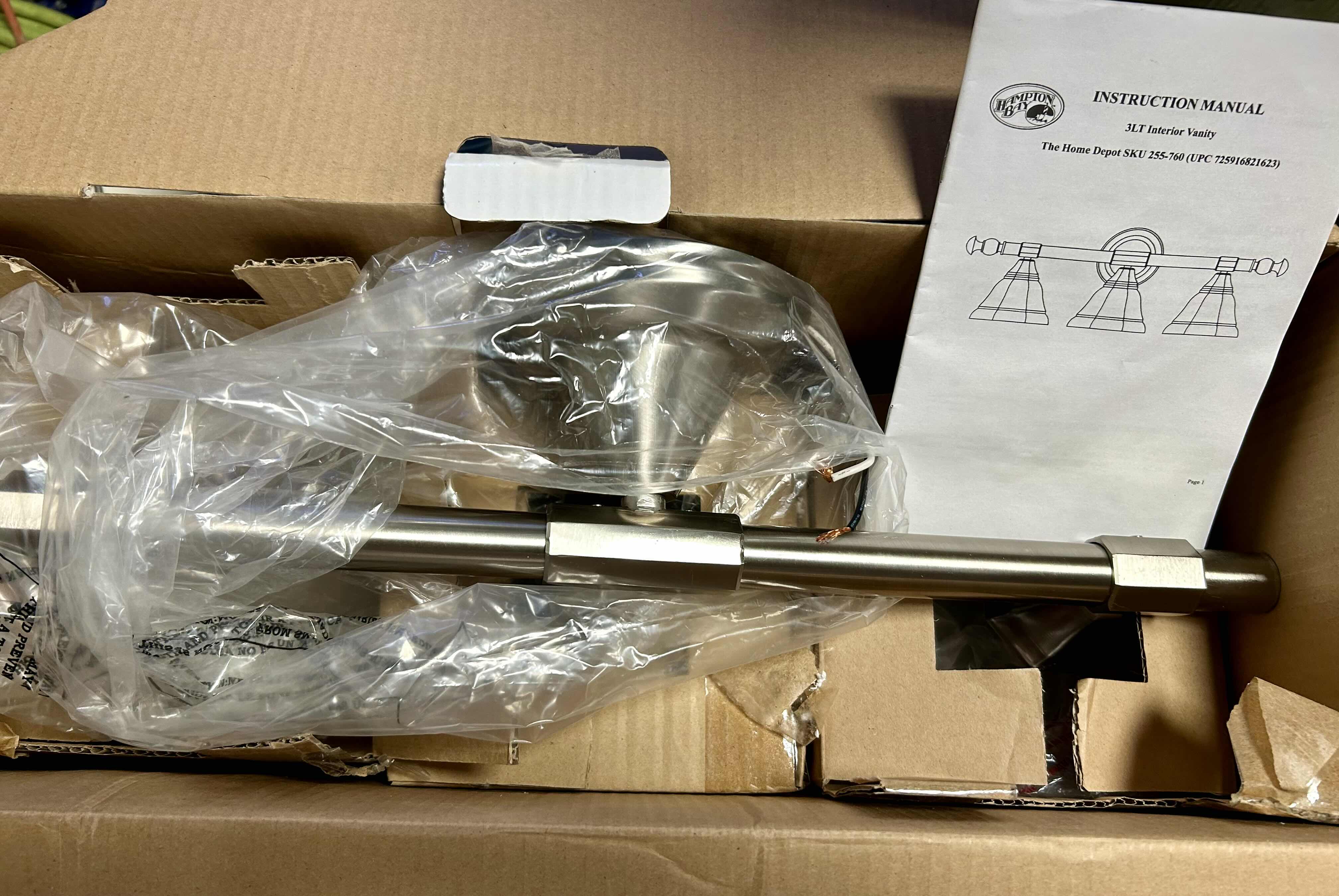 Photo 1 of HAMPTON BAY VANITY 3 LIGHT FIXTURE WITH PEWTER FINISH AND FROSTED GLASS SHADES .
26” X 7” H 9.25”