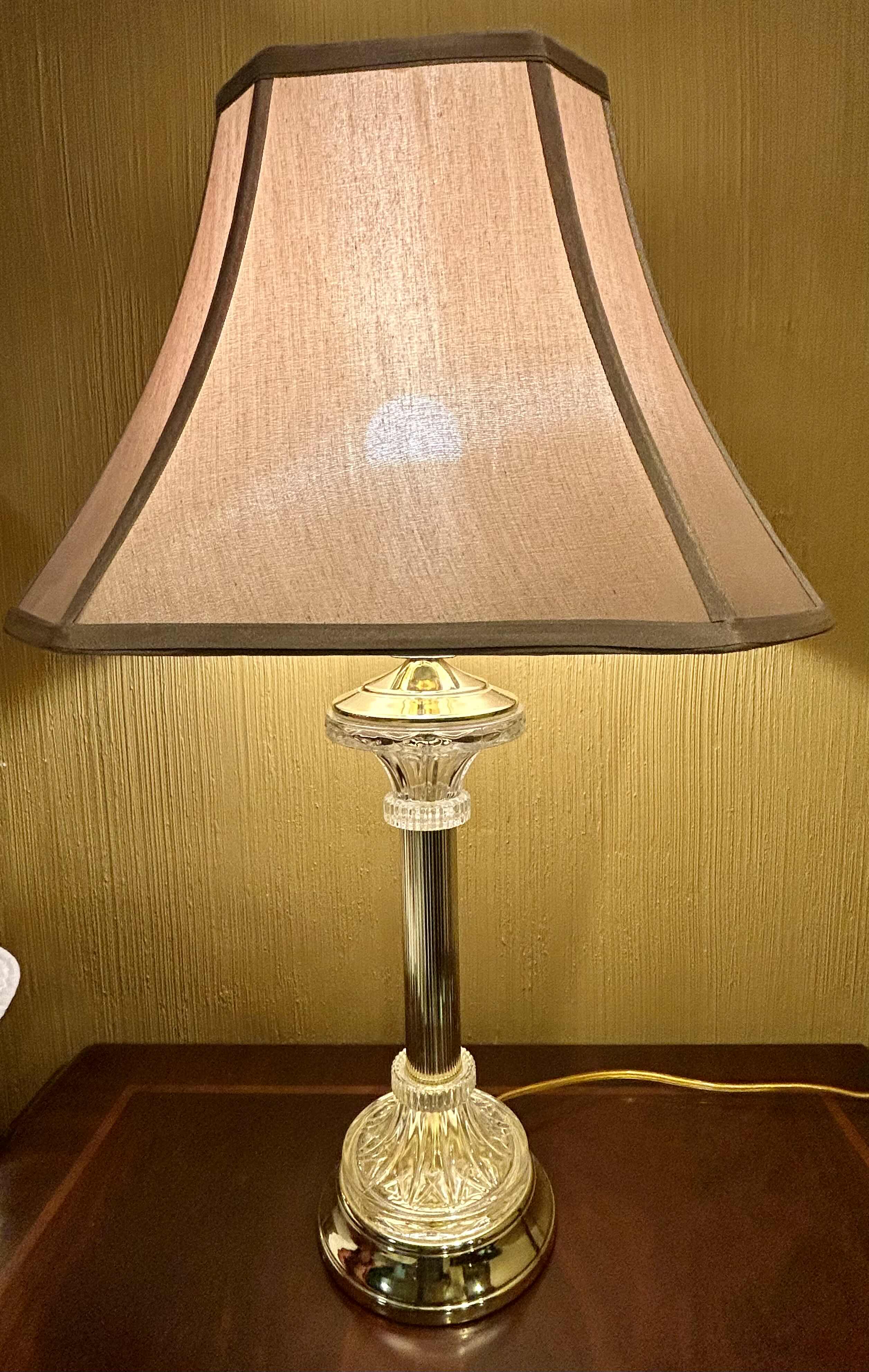 View 1 of BRASS AND CRYSTAL LAMP WITH TAN COLORED BELL SHAPED SHADE H28”

100.00