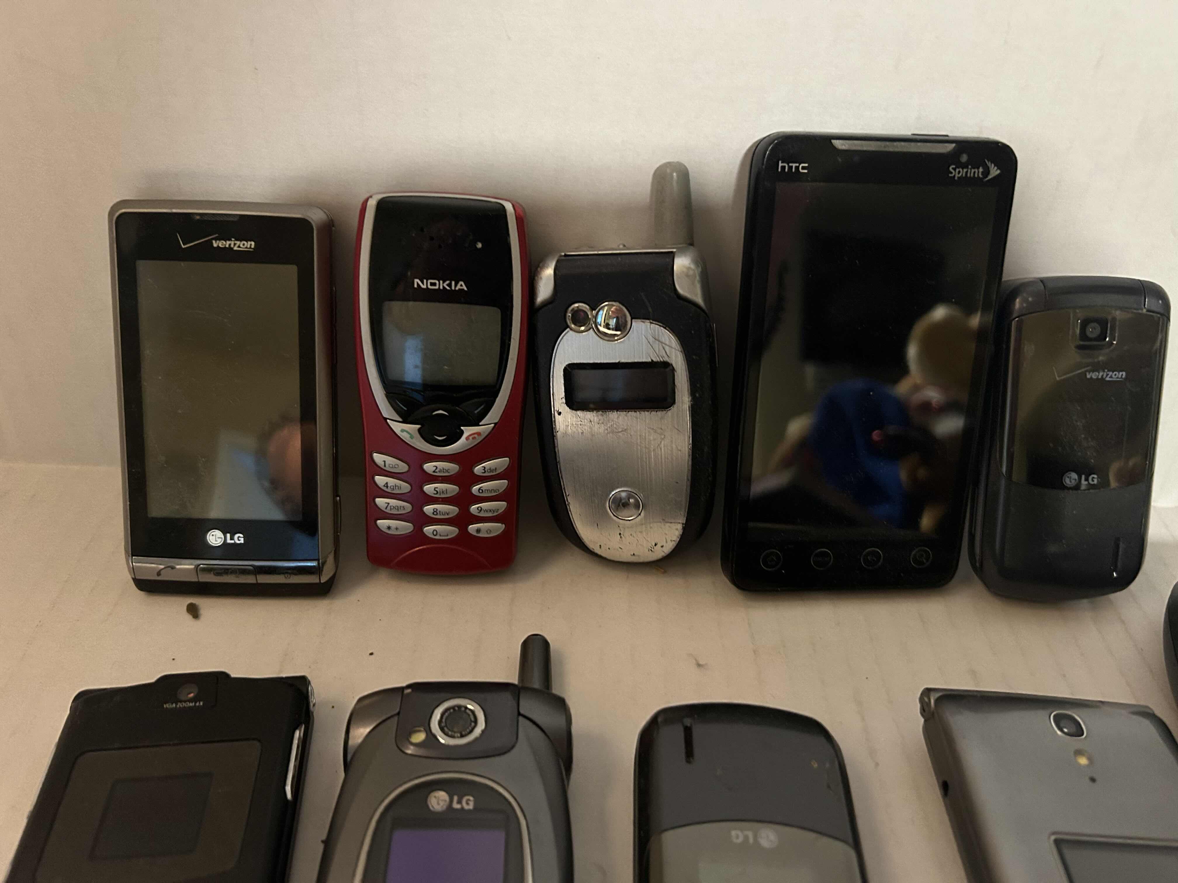 Photo 1 of 9 CELLPHONES, MOSTLY FLIP PHONES