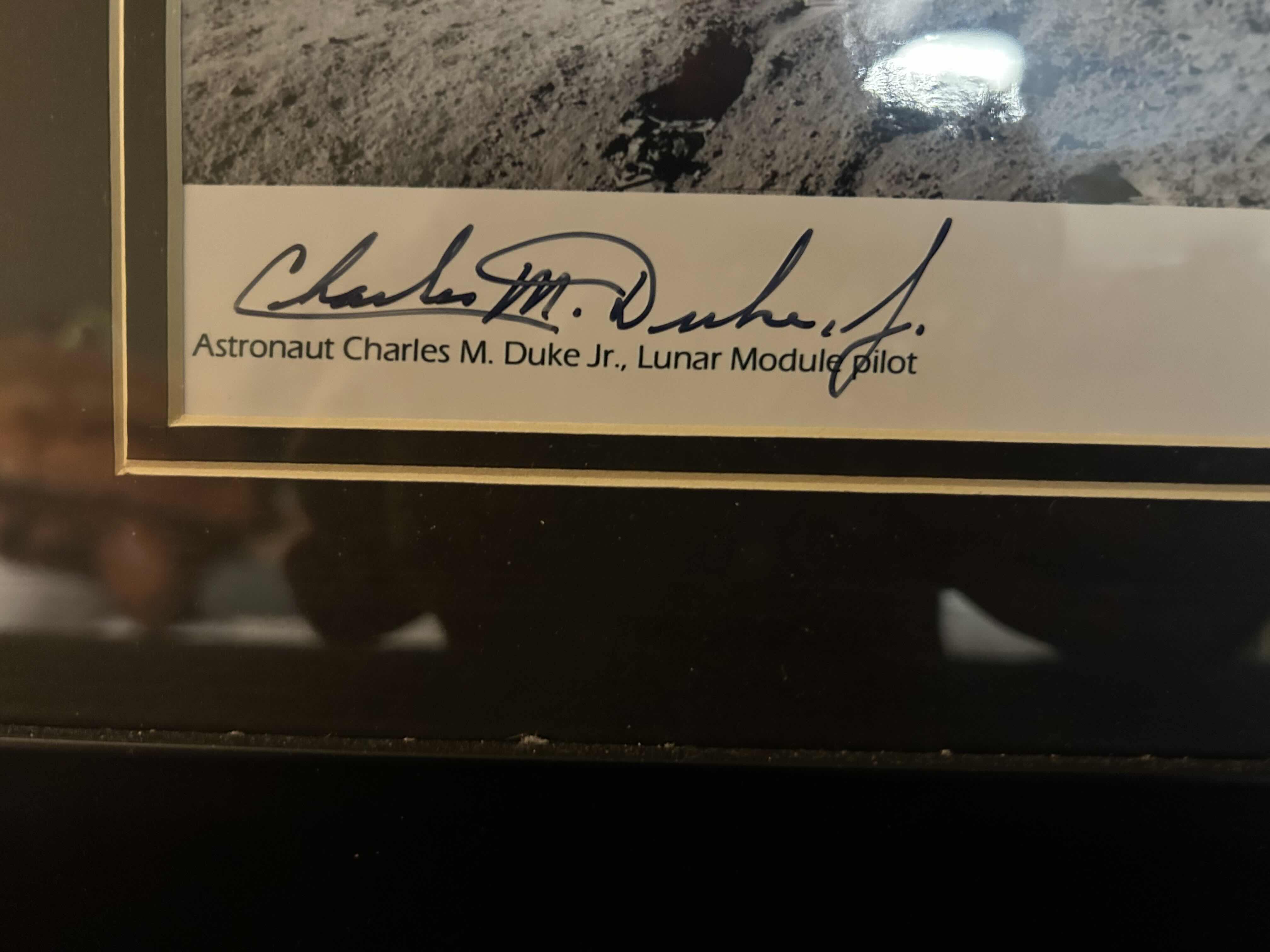 Photo 1 of APOLLO 16 FRAMED PHOTOGRAPH SIGNED BY ASTRONAUT CHARLIE DUKE WITH CERTIFICATE OF AUTHENTICITY IN BLACK FRAME 16” X 13” 

300.00