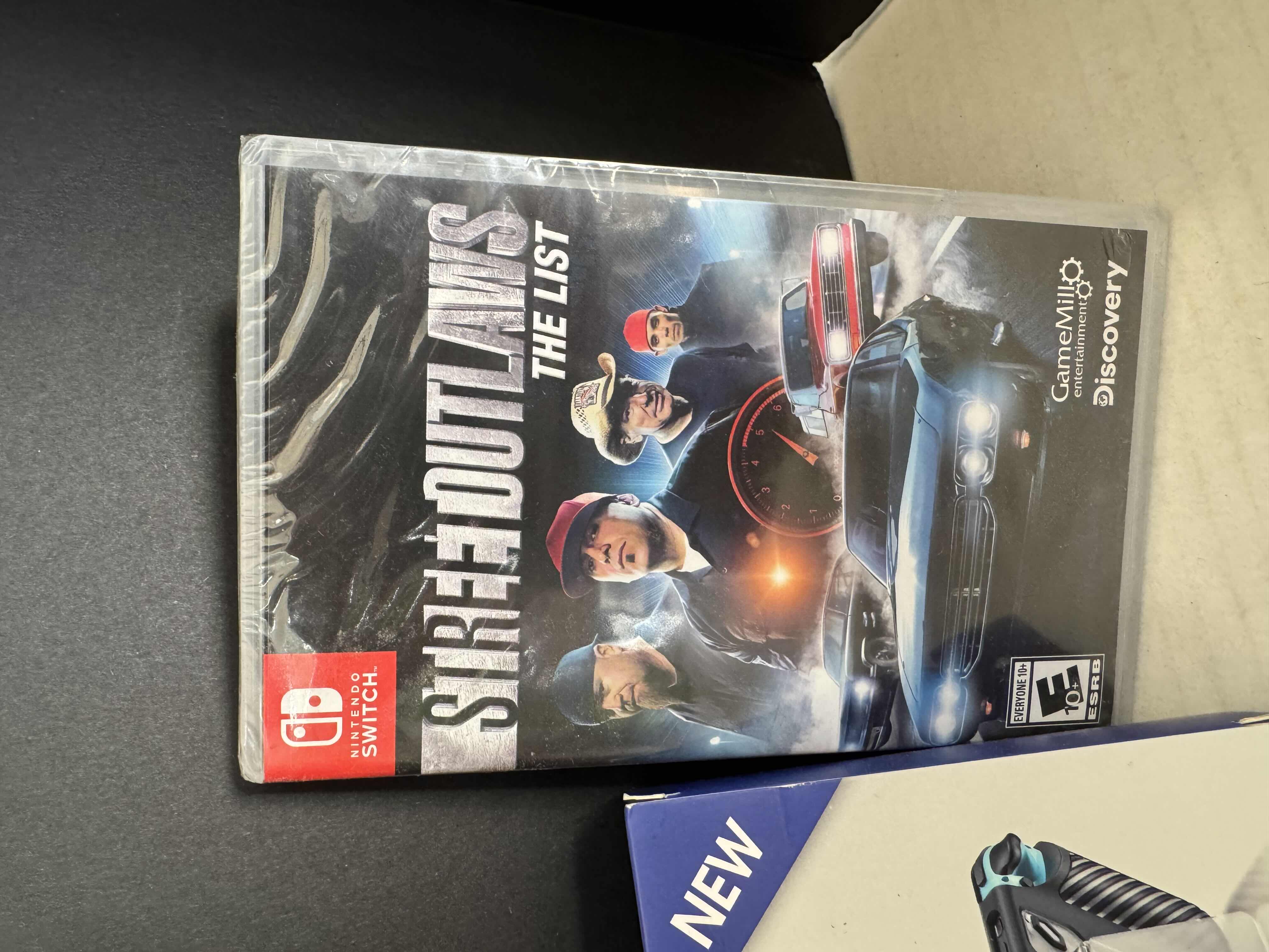 Photo 1 of BRAND NEW NINTENDO SWITCH CASE AND STREET OUTLAWS VIDEO GAME