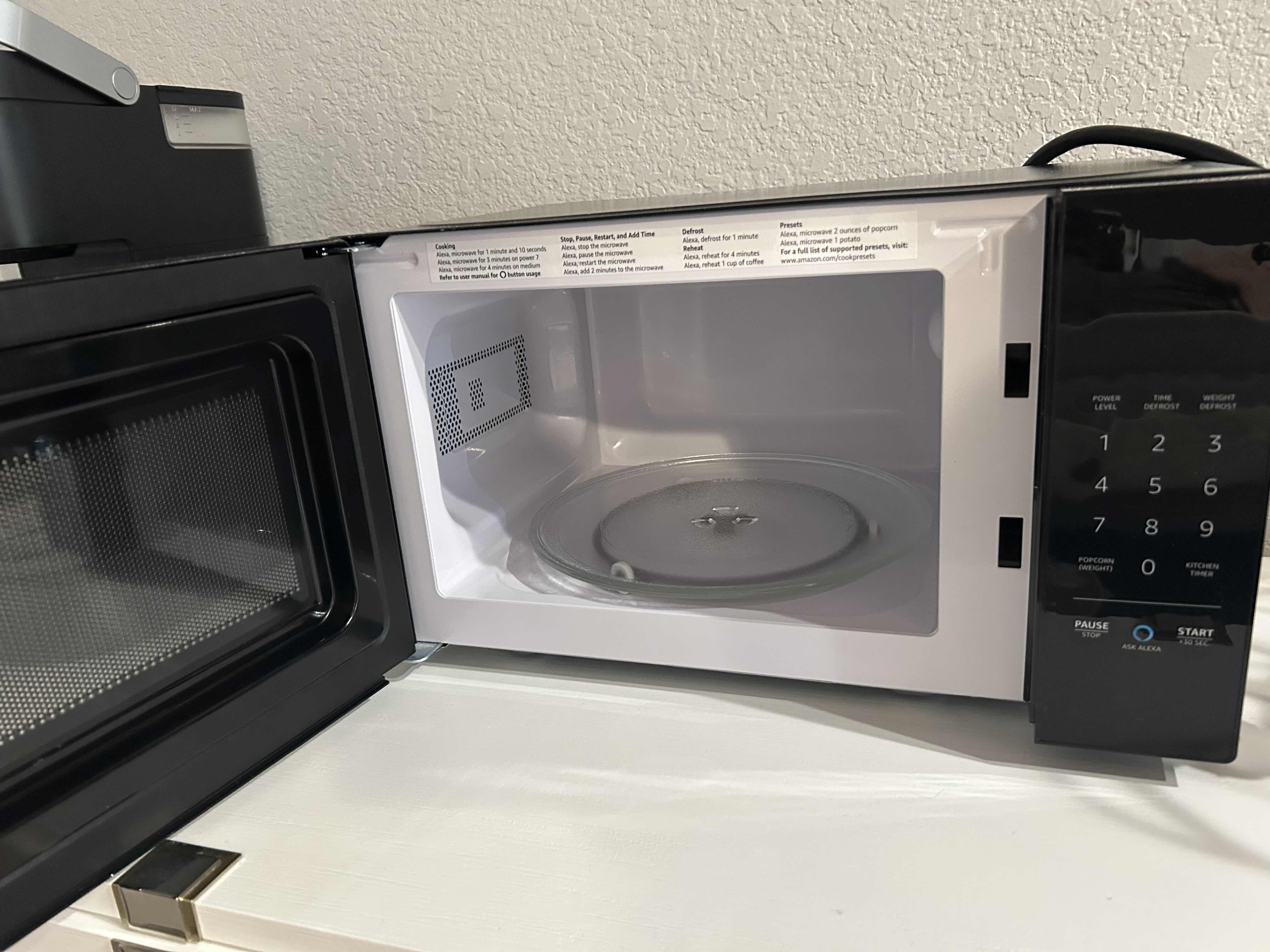 Photo 1 of AMAZONBASICS BLACK COUNTER TOP MICROWAVE - WORKS WITH ALEXA