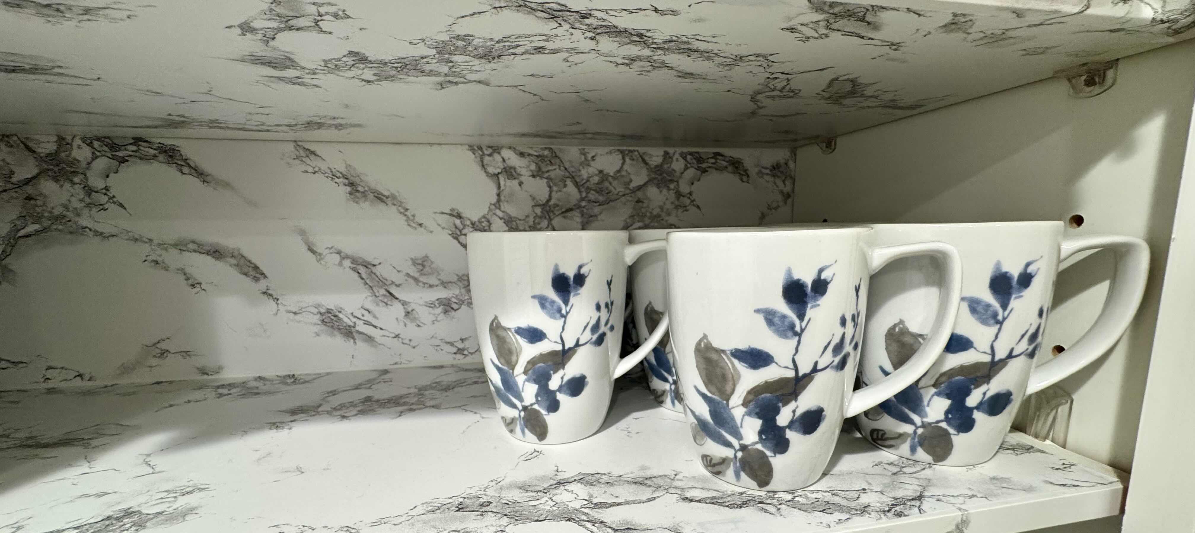 Photo 1 of 8-CONTENTS OF SHELF SET OF BLUE FLORAL COFFEE/TEA CUPS. 