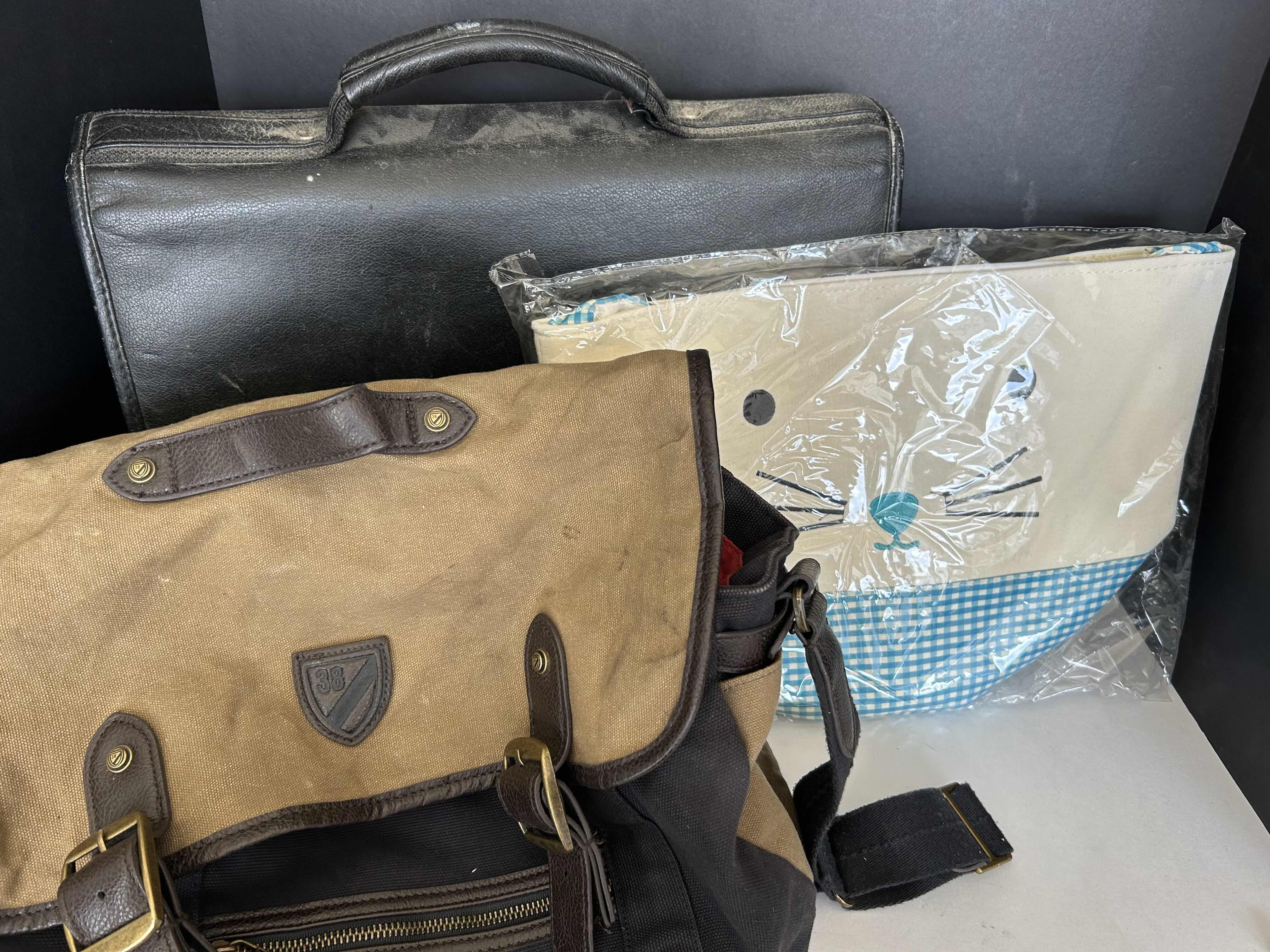 Photo 1 of 3 BAGS - 1 BRIEFCASE, 1 SATCHEL, 1 BRAND NEW KITTY FACED BAG