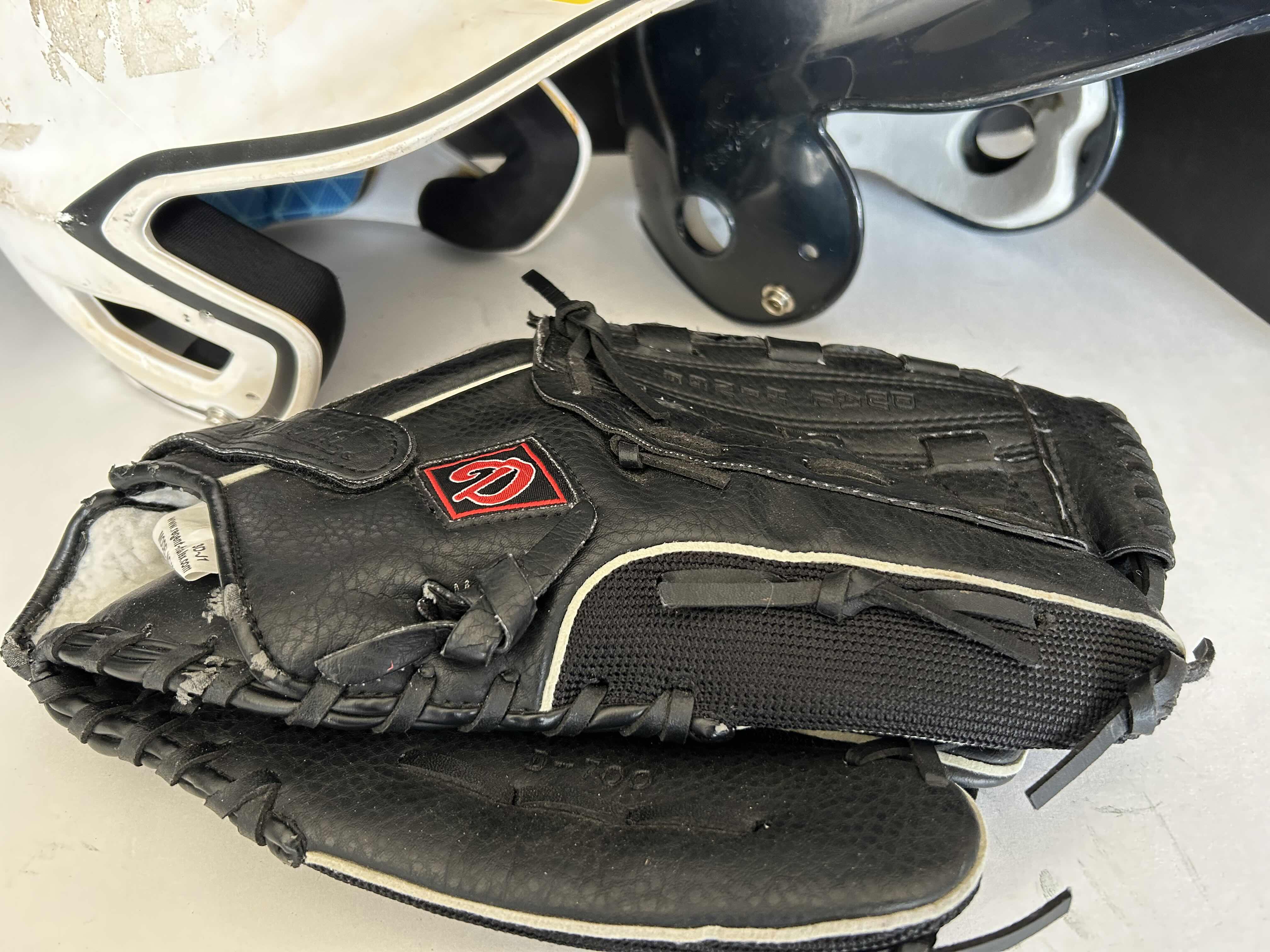 Photo 1 of 2 BASEBALL HELMETS AND 1 GLOVE - WHITE EASTON HELMET SIZE 7 1/8”-7 1/2” BLACK RAWLINGS HELMET SIZE 6 1/4”-7 7/8”