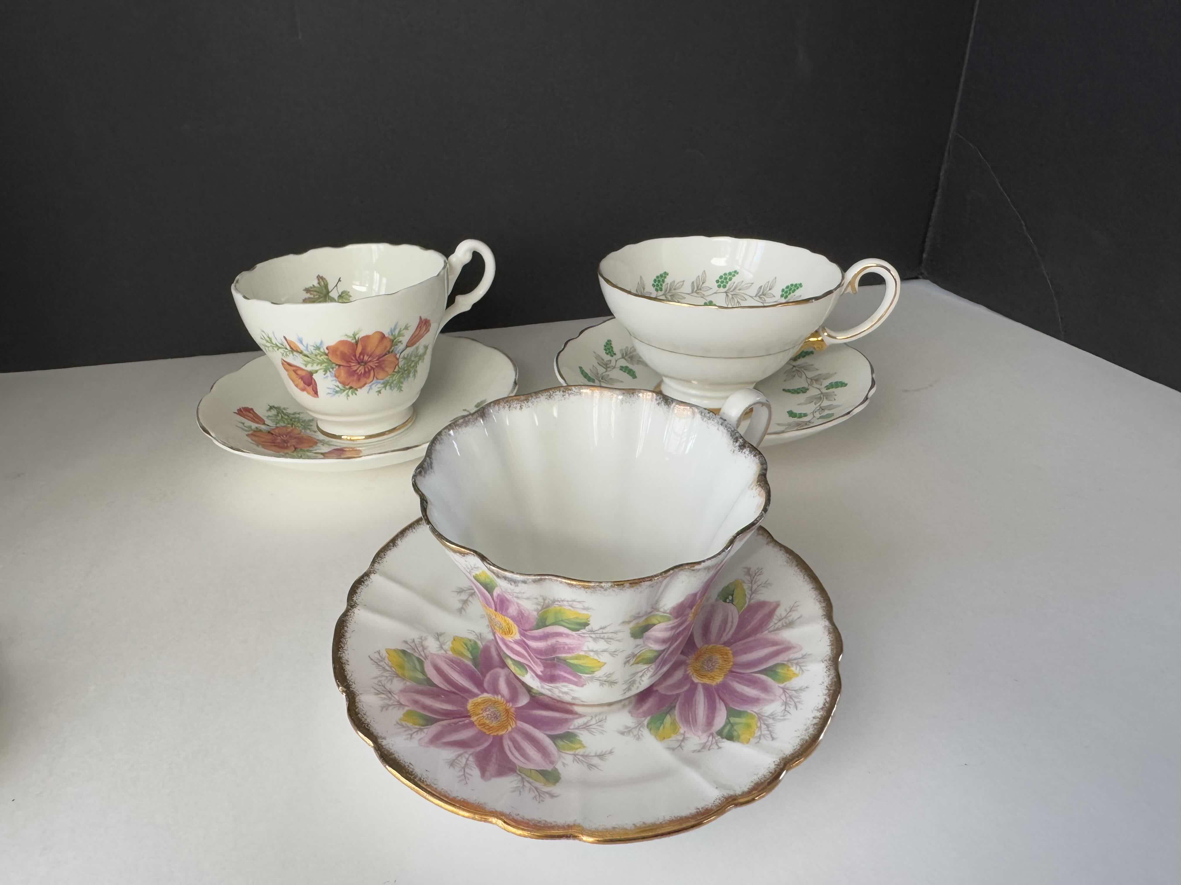 Photo 1 of 3 SETS OF SAUCERS WITH TEACUPS