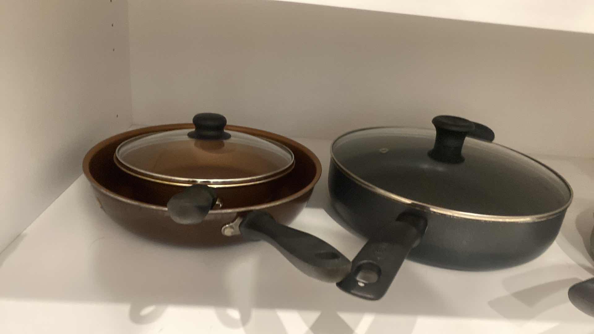 Photo 1 of CONTENTS OF KITCHEN CABINET POTS & PANS