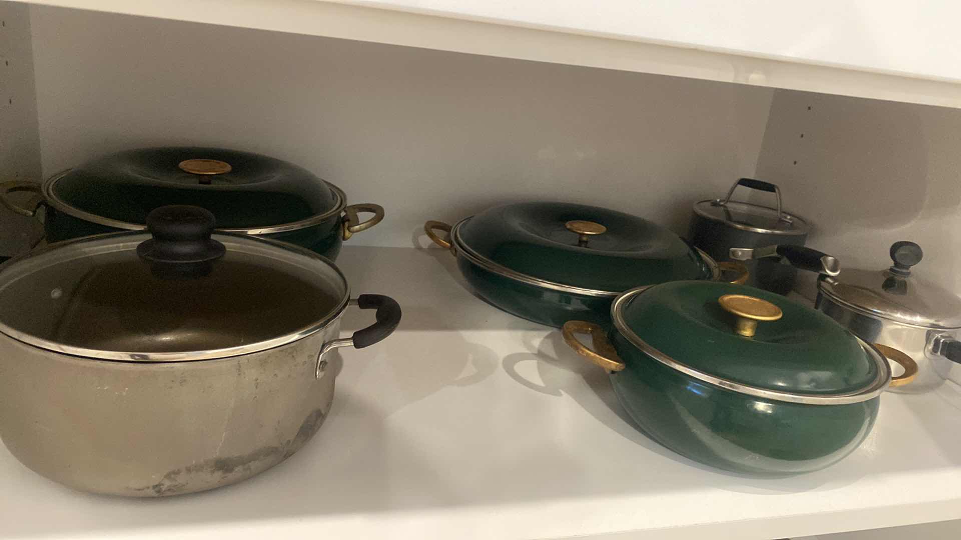 Photo 1 of CONTENTS OF KITCHEN CABINET POTS & PANS