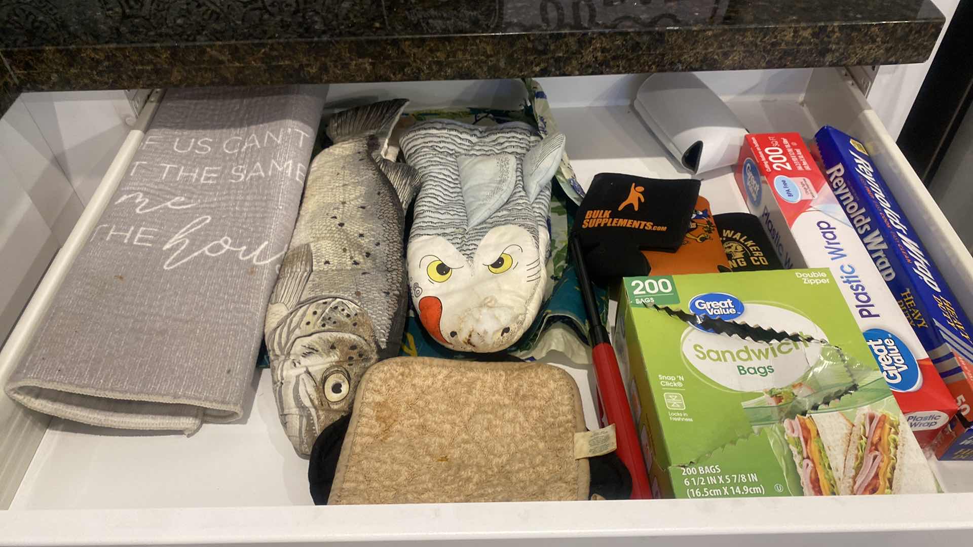 Photo 1 of CONTENTS OF KITCHEN CABINET WRAPPINGS & LINENS