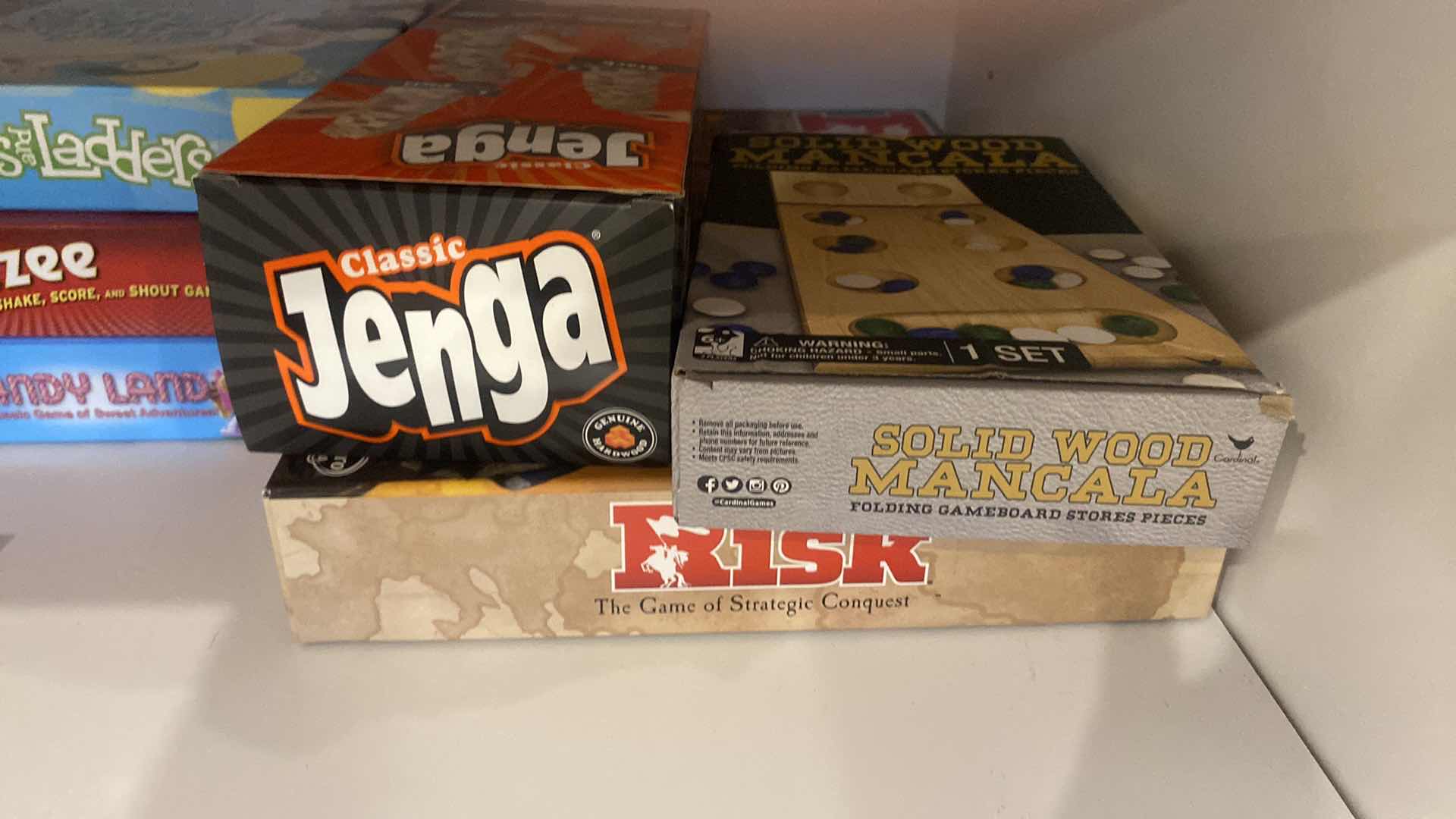 Photo 1 of CONTENTS OF KITCHEN CABINET ASSORTED GAMES