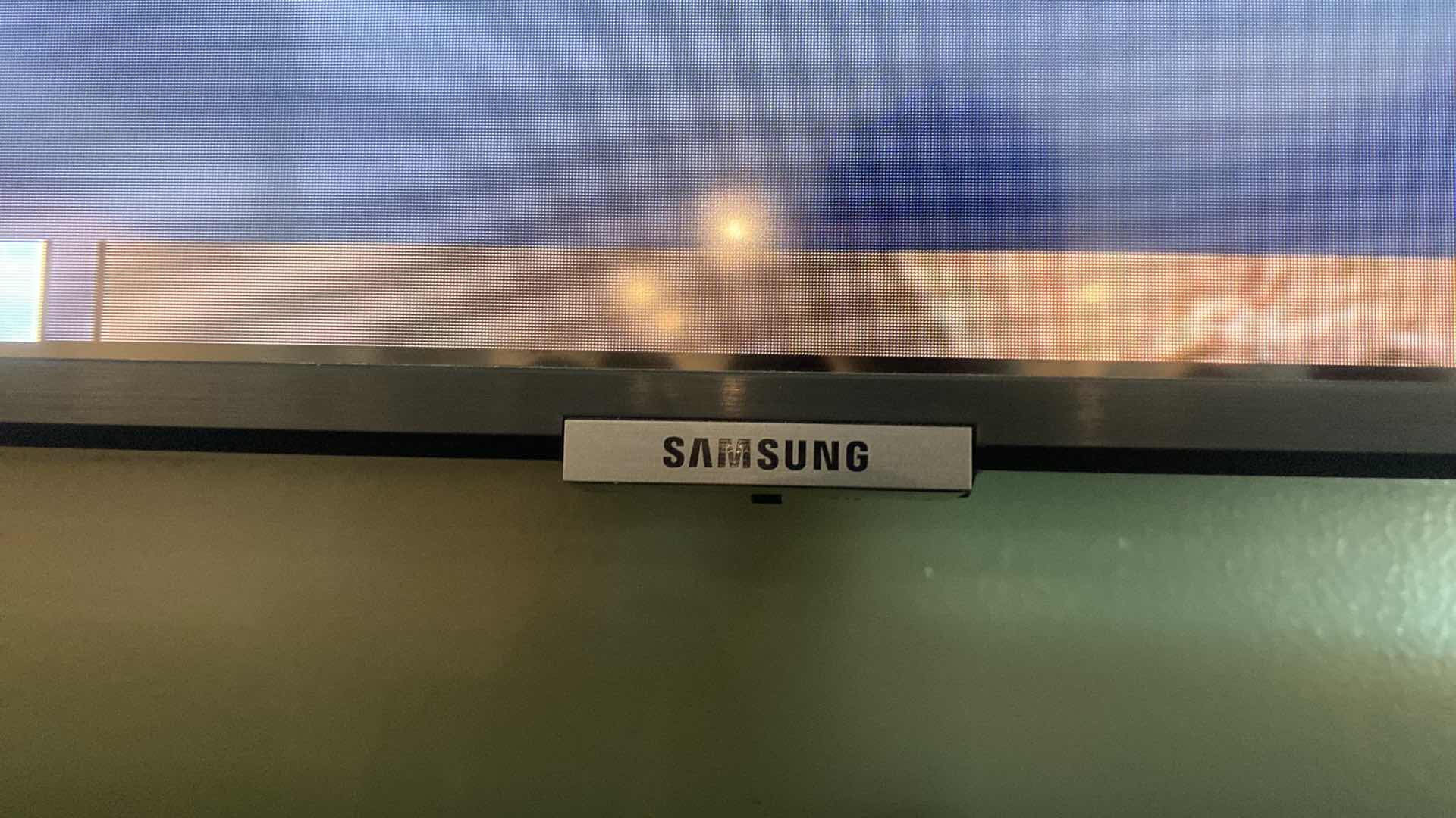 Photo 1 of SAMSUNG 65” SMART TV W REMOTE AND BASE SOUND BAR W. REMOTE