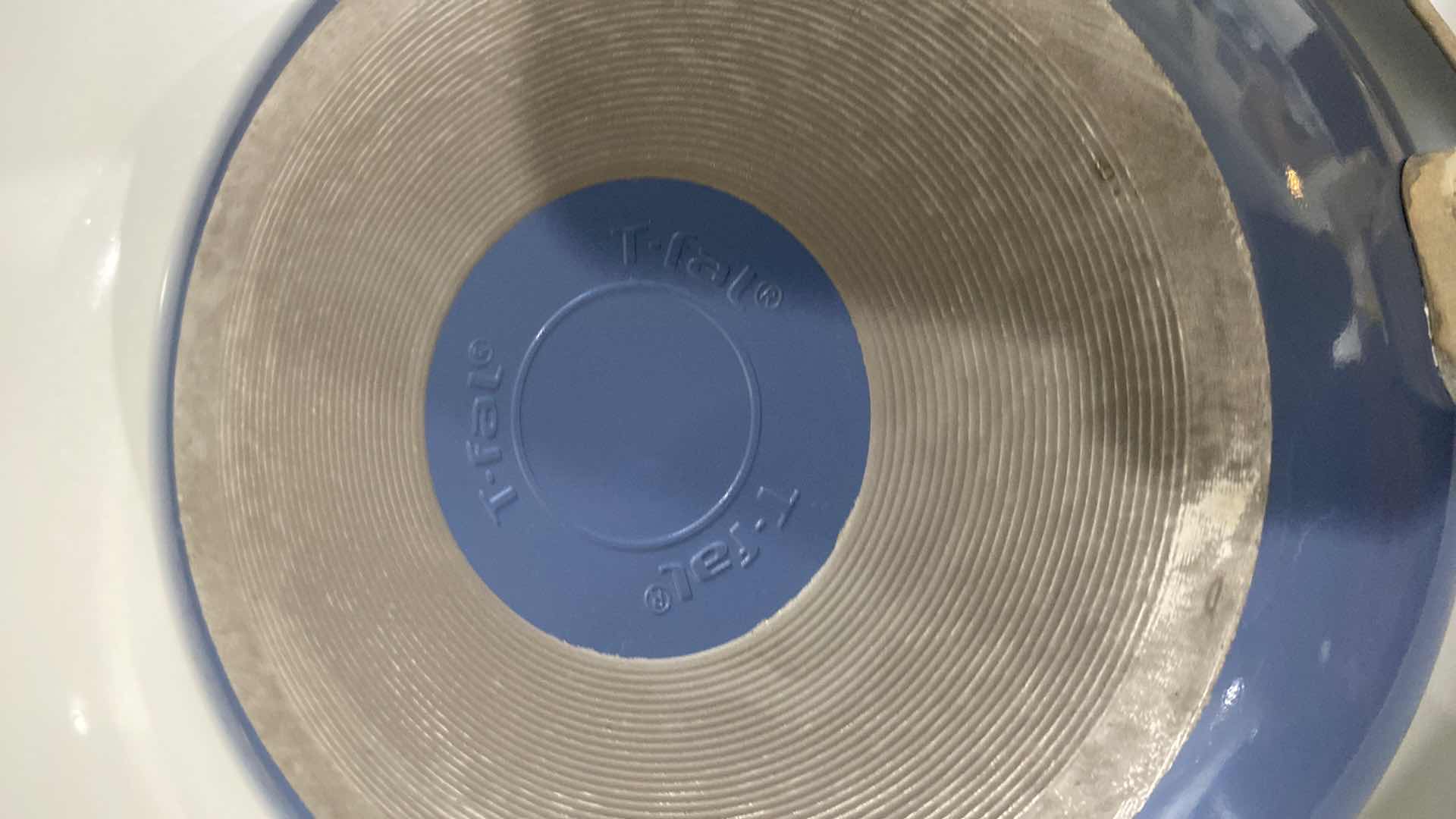 Photo 1 of CONTENTS KITCHEN CABINET - 9 PIECE T-FAL POTS & PANS