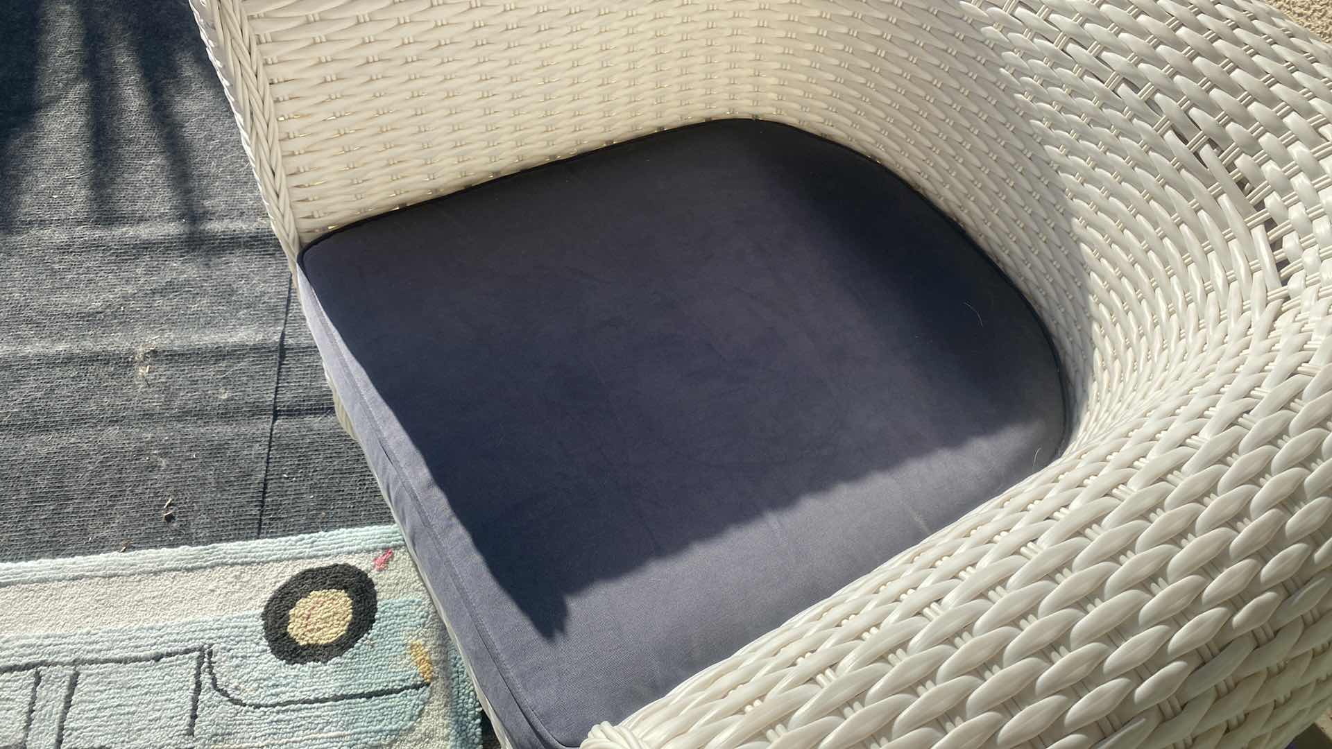 Photo 1 of PLASTIC WICKER PATIO CHAIR WITH FADED BLACK CUSHION 42“ x 33“ H 29” (2 available each sold separately)