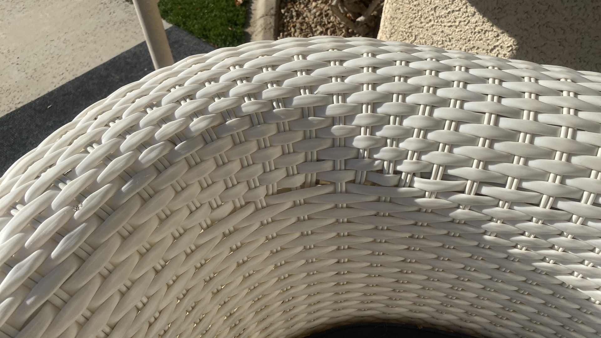 Photo 1 of PLASTIC WICKER PATIO CHAIR WITH FADED BLACK CUSHION 42“ x 33“ H 29” (2 available each sold separately)