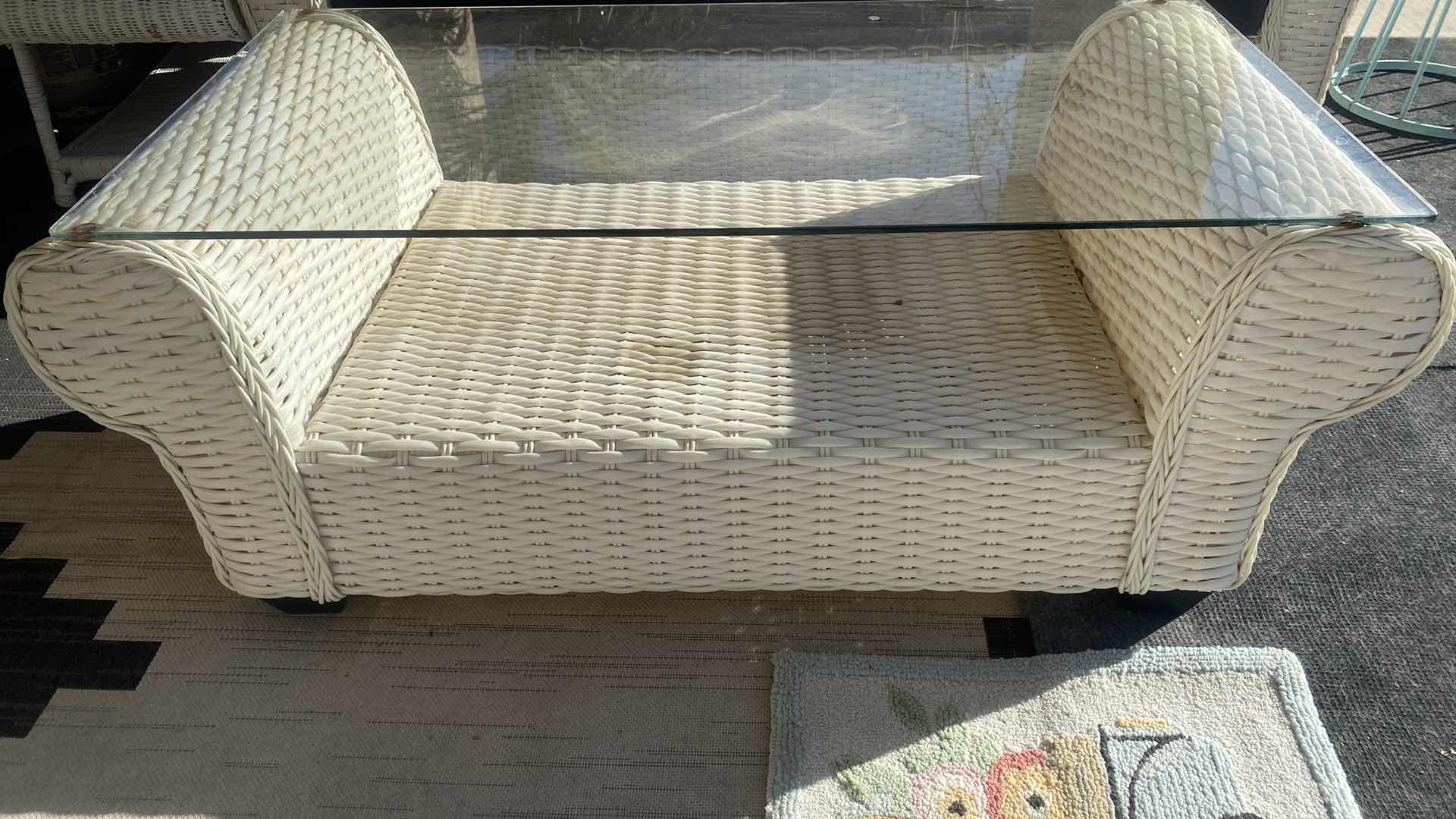 Photo 1 of PLASTIC WICKER PATIO TABLE WITH GLASS TOP 52“ x 25“ H 21”