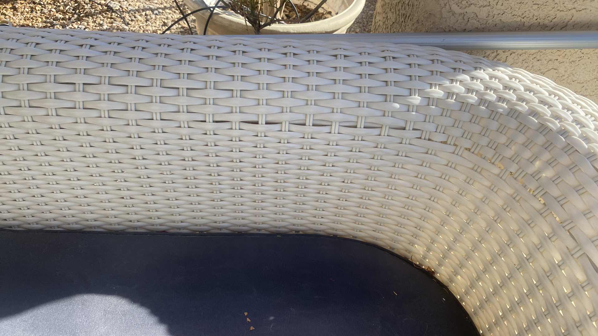 Photo 1 of PLASTIC WICKER OUTDOOR SOFA WITH FADED BLACK CUSHION 80” x 33“ H 27”