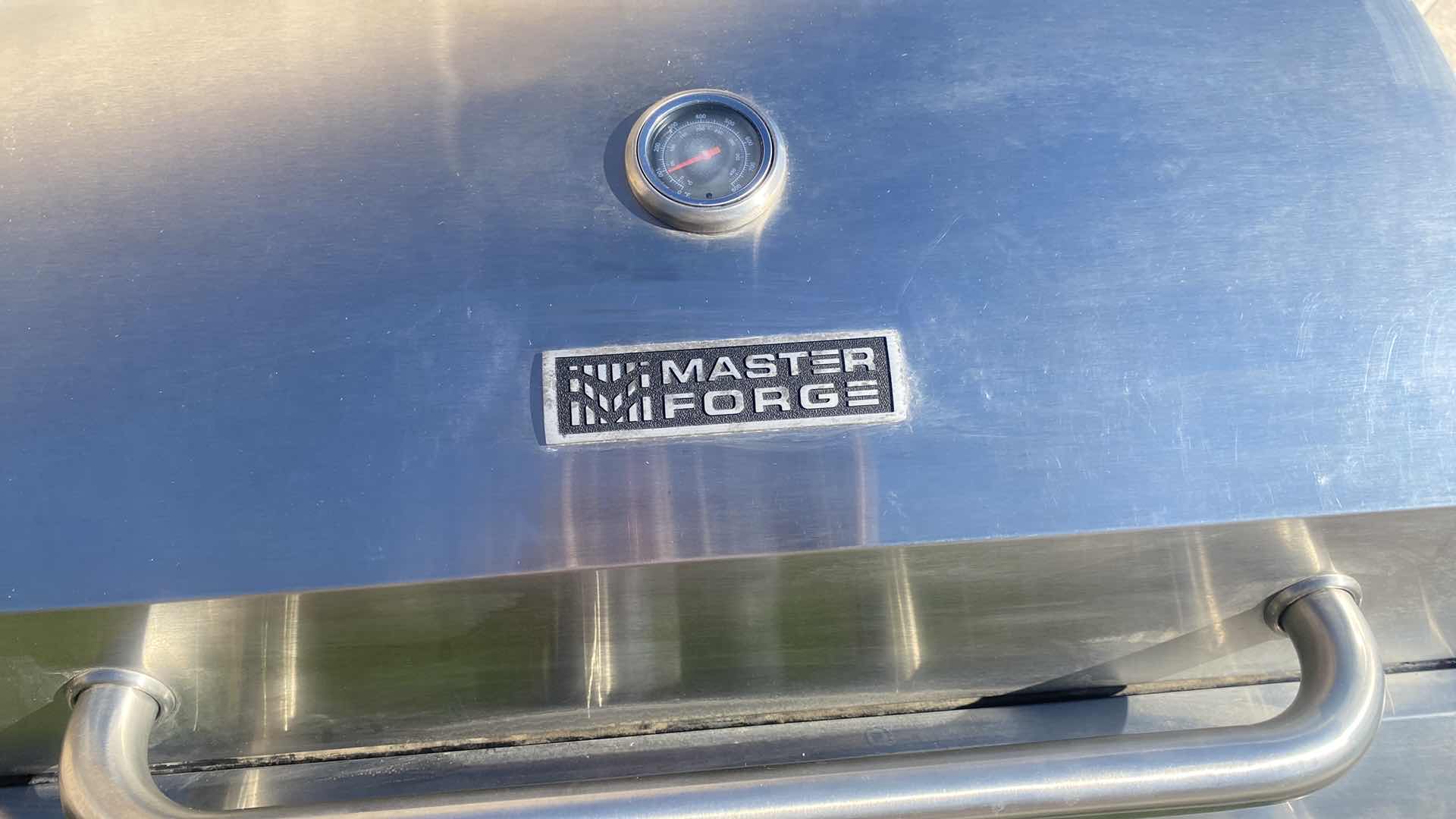 Photo 1 of MASTER FORGE GRILL WITH PROPANE TANK