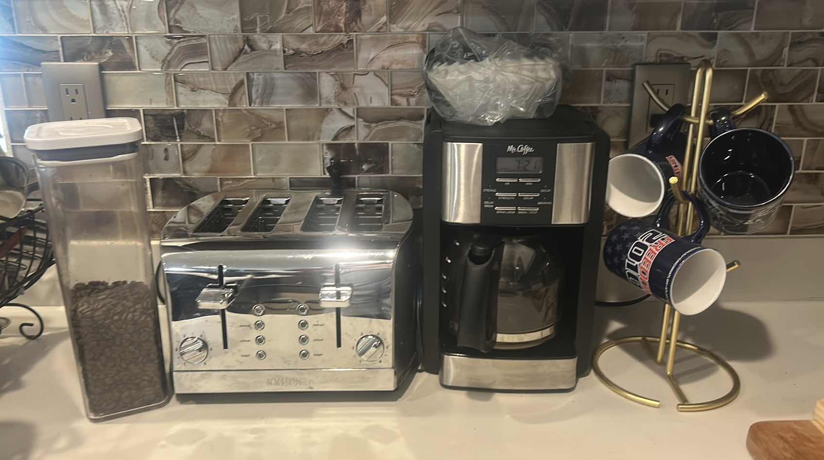 Photo 1 of KRUPS TOASTER, MR COFFEE MAKER, COFFEE MUGS WITH STAND AND COFFEE BEANS