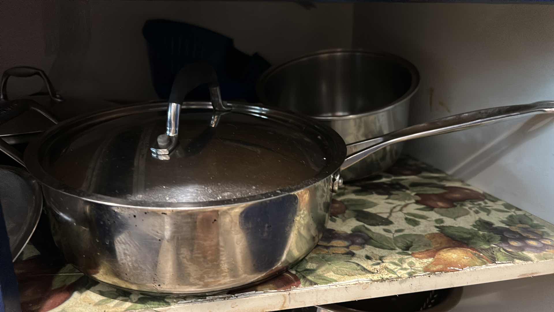 Photo 1 of CONTENTS OF CABINET IN KITCHEN- POTS AND PANS