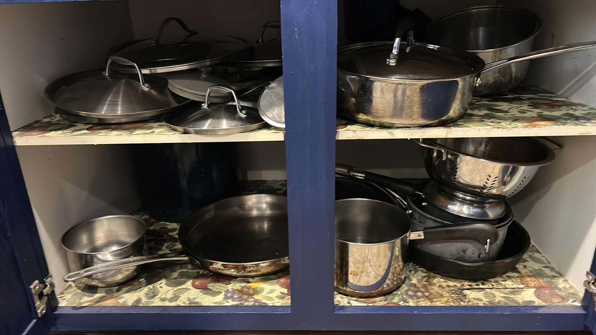 Photo 1 of CONTENTS OF CABINET IN KITCHEN- POTS AND PANS